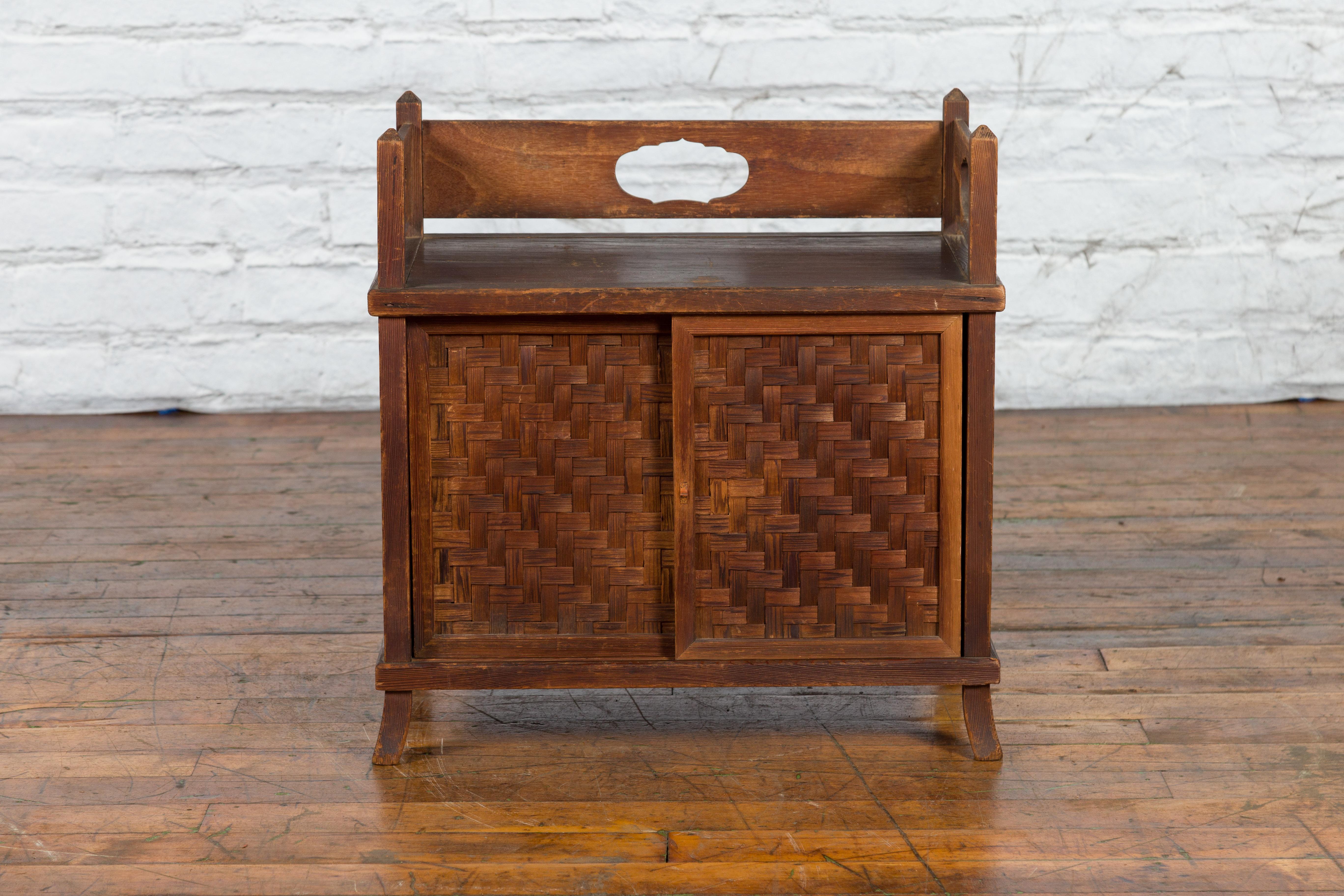 Carved Javanese Vintage Side Cabinet with Latticed Bamboo Sliding Doors and Gallery For Sale