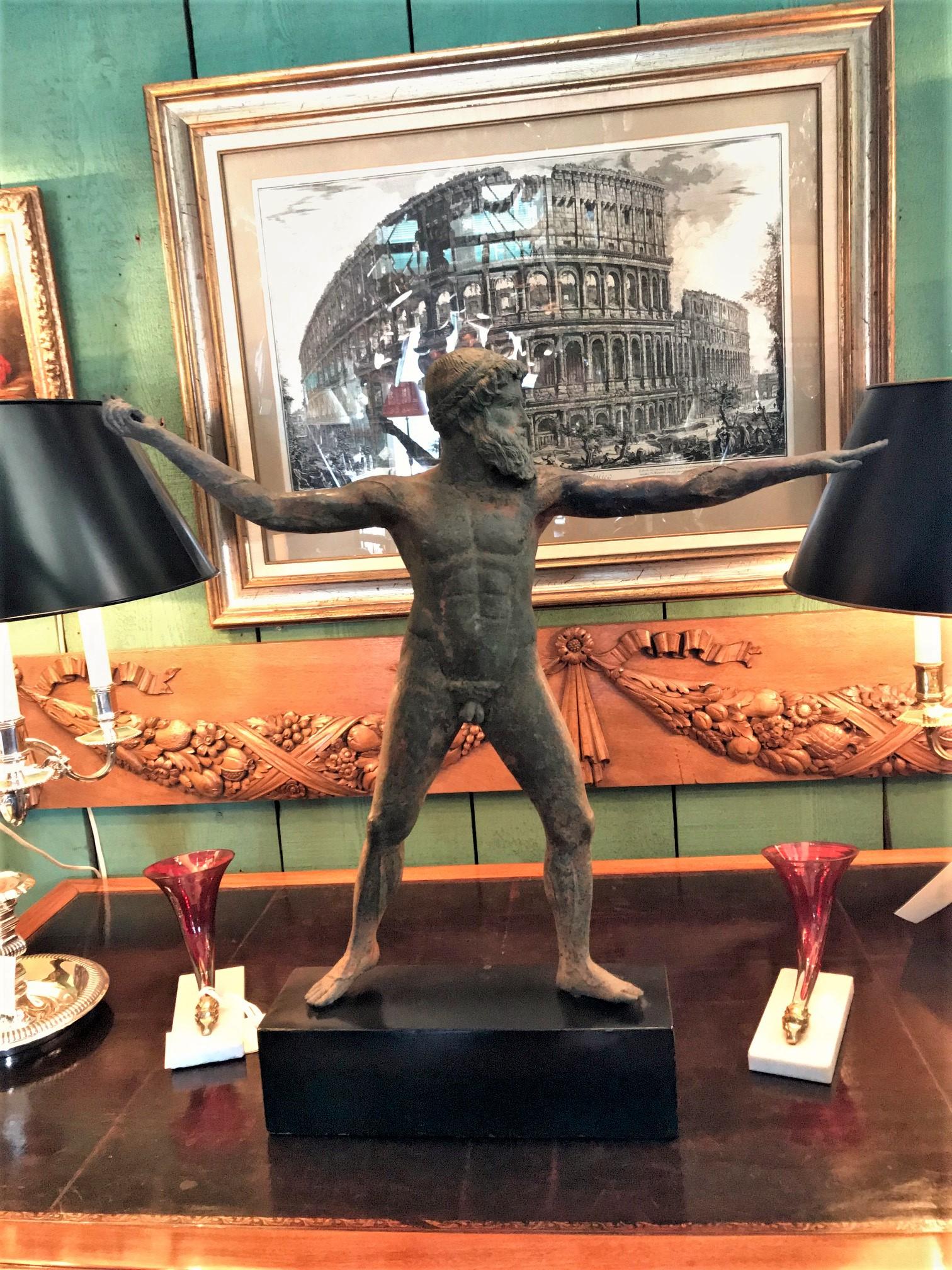 A beautiful Javelin Thrower  bronze statue of Zeus of Artemisia javelin thrower 1st -2nd quarter of the 1900s mounted on a black dark painted base in the style of a beautiful bronze statue of Zeus (or possibly Poseidon) was recovered from a
