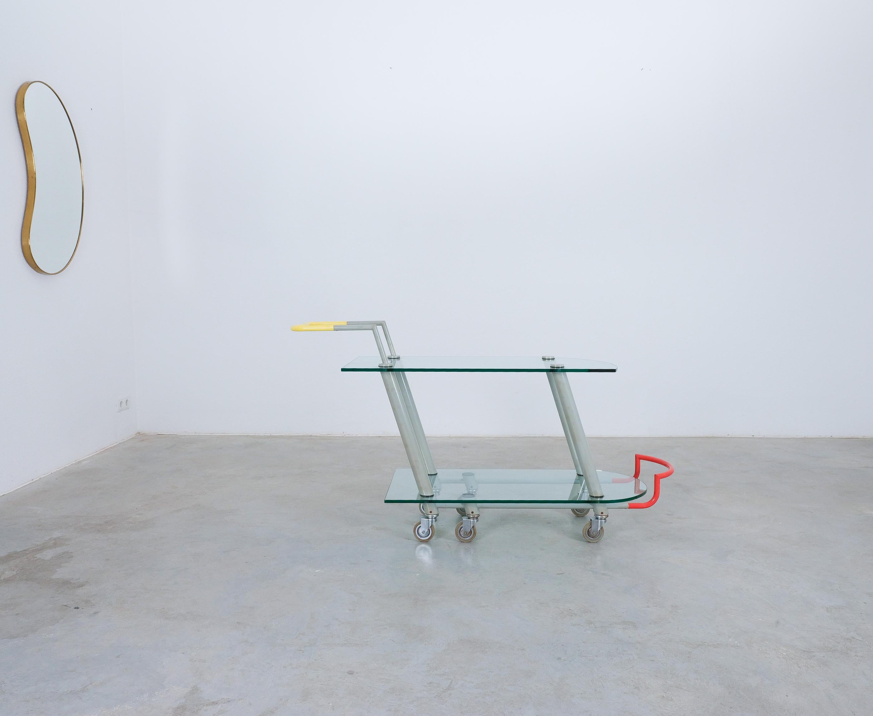 Javier Mariscal Post-Modern Bar Cart Hilton For Memphis , Italy, 1981

Rare Memphis bar cart ‚Hilton’, trolley on smoothly running casters offering a lot of space for putting bottles glasses or books. It’s a statement piece with dynamic lines, cool
