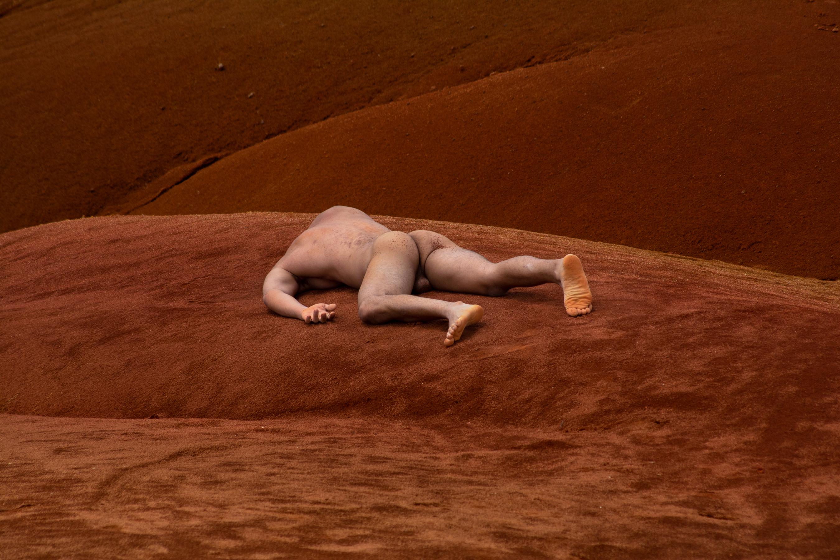 Javier Rey Nude Photograph - Engulfment, Mosquera 5.   Nude in a landscape color photo.
