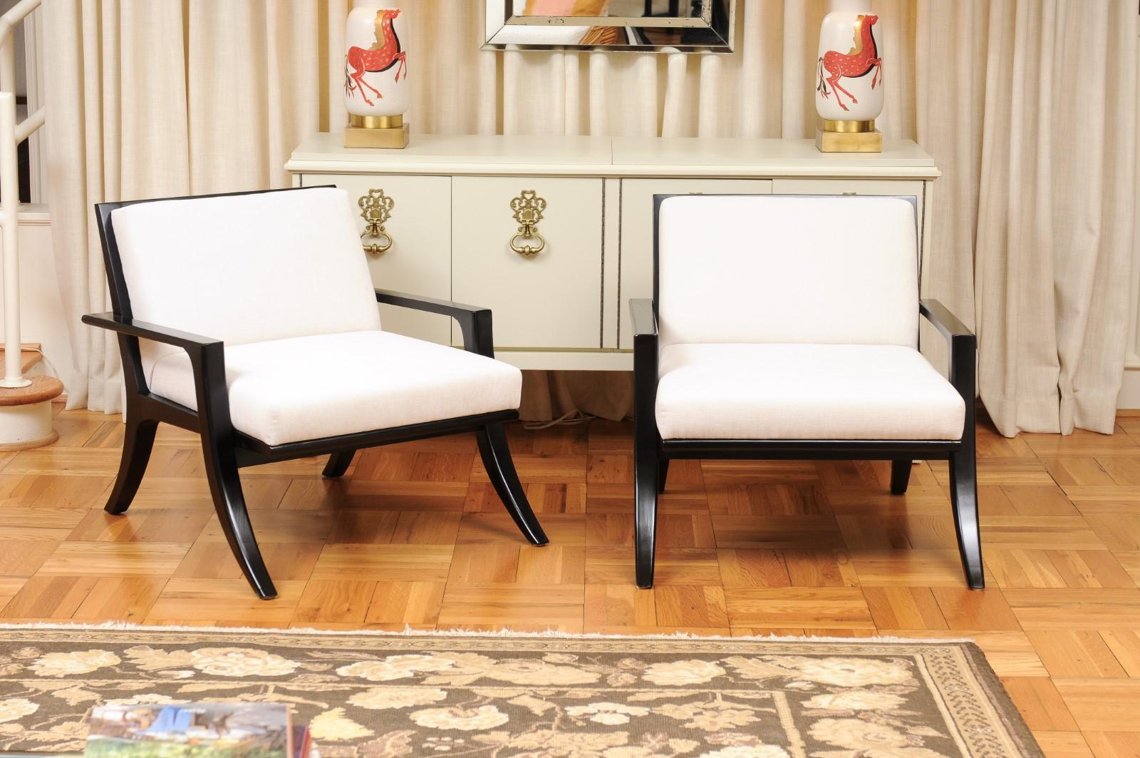 These magnificent lounge chairs are shipped as professionally photographed and described in the listing narrative: Meticulously professionally restored, expertly upholstered and installation ready. There are two (2) identical pairs available. The