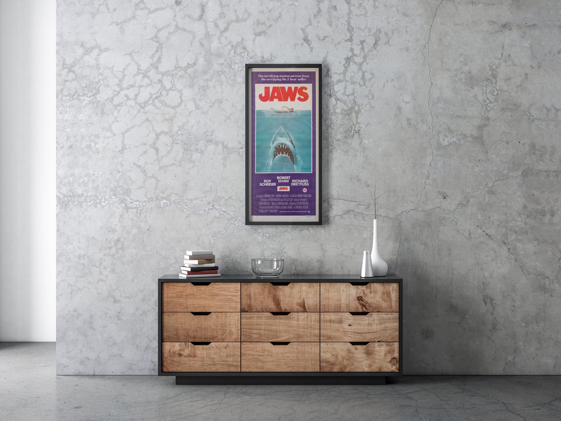 Featuring the same classic Roger Kastel artwork, the Jaws Australian Daybill is a great, collectable item and more affordable alternative to the country-of-origin US poster.

This vintage movie poster is sized 13 3/8 x 29 3/4 inches. It will be sent
