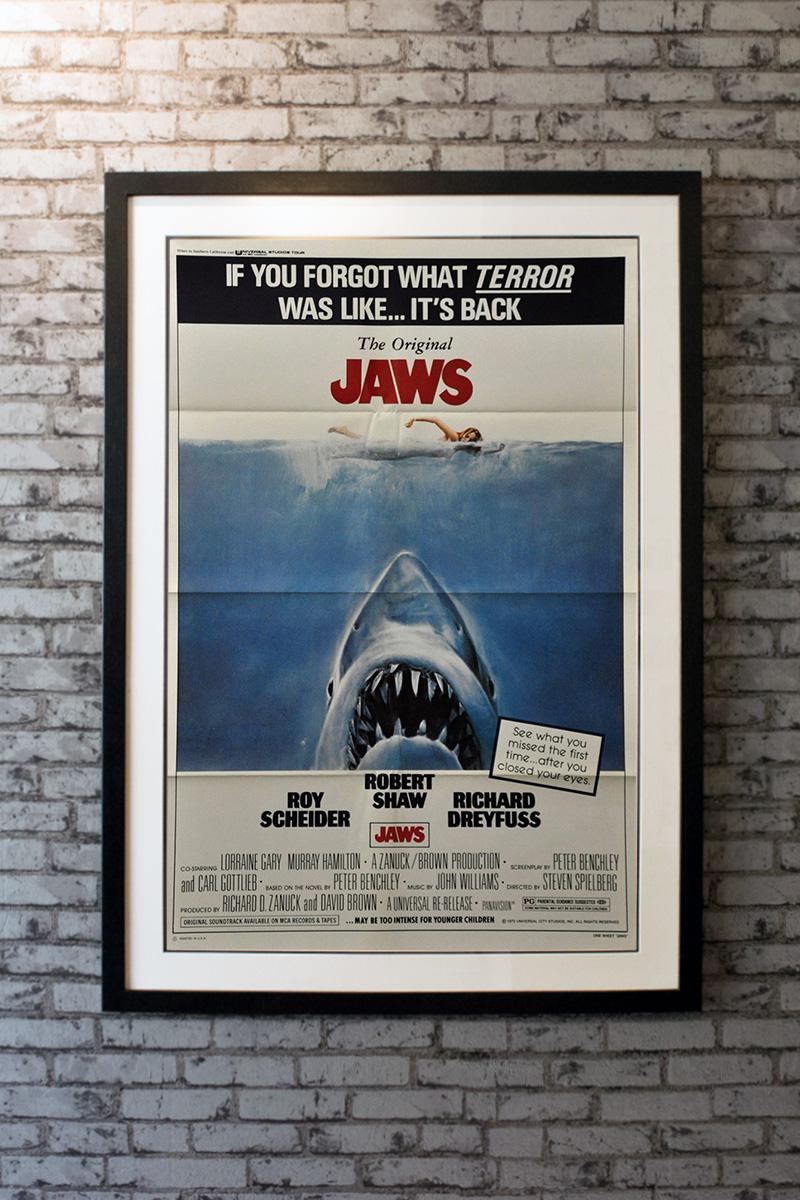 1979 re-release poster. If you forgot what terror was like ... It's back. When a young woman is killed by a shark while skinny-dipping near the New England tourist town of Amity Island, police chief Martin Brody (Roy Scheider) wants to close the
