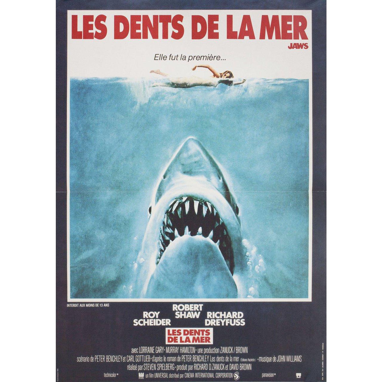 Original 1989 re-release French petite poster for the 1975 film Jaws directed by Steven Spielberg with Roy Scheider / Robert Shaw / Richard Dreyfuss / Lorraine Gary. Fine condition, folded. Many original posters were issued folded or were