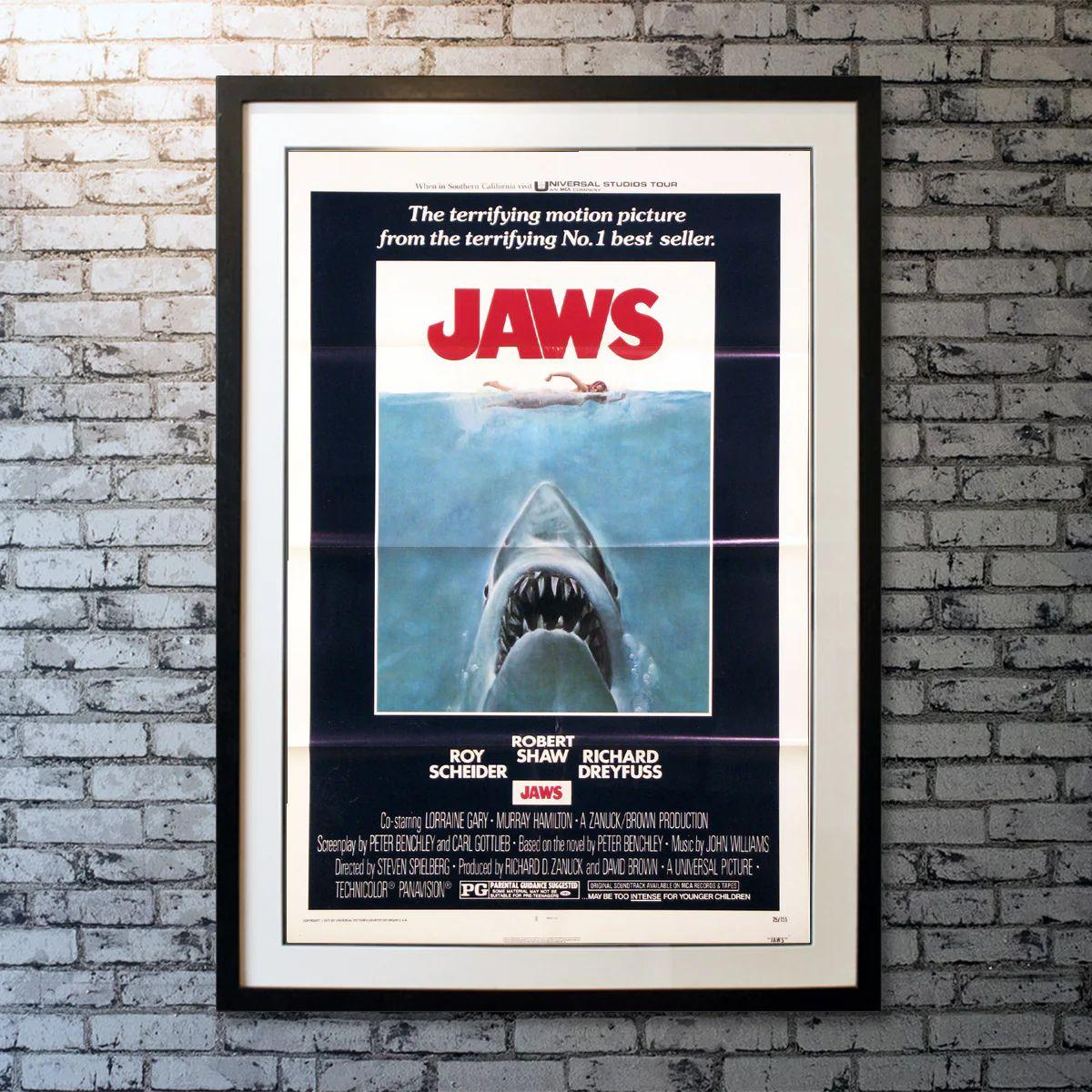 Jaws, Unframed Poster, 1975 *Tri-Folded*

Original One Sheet (27 X 41 Inches). When a killer shark unleashes chaos on a beach community off Cape Cod, it's up to a local sheriff, a marine biologist, and an old seafarer to hunt the beast down.

This