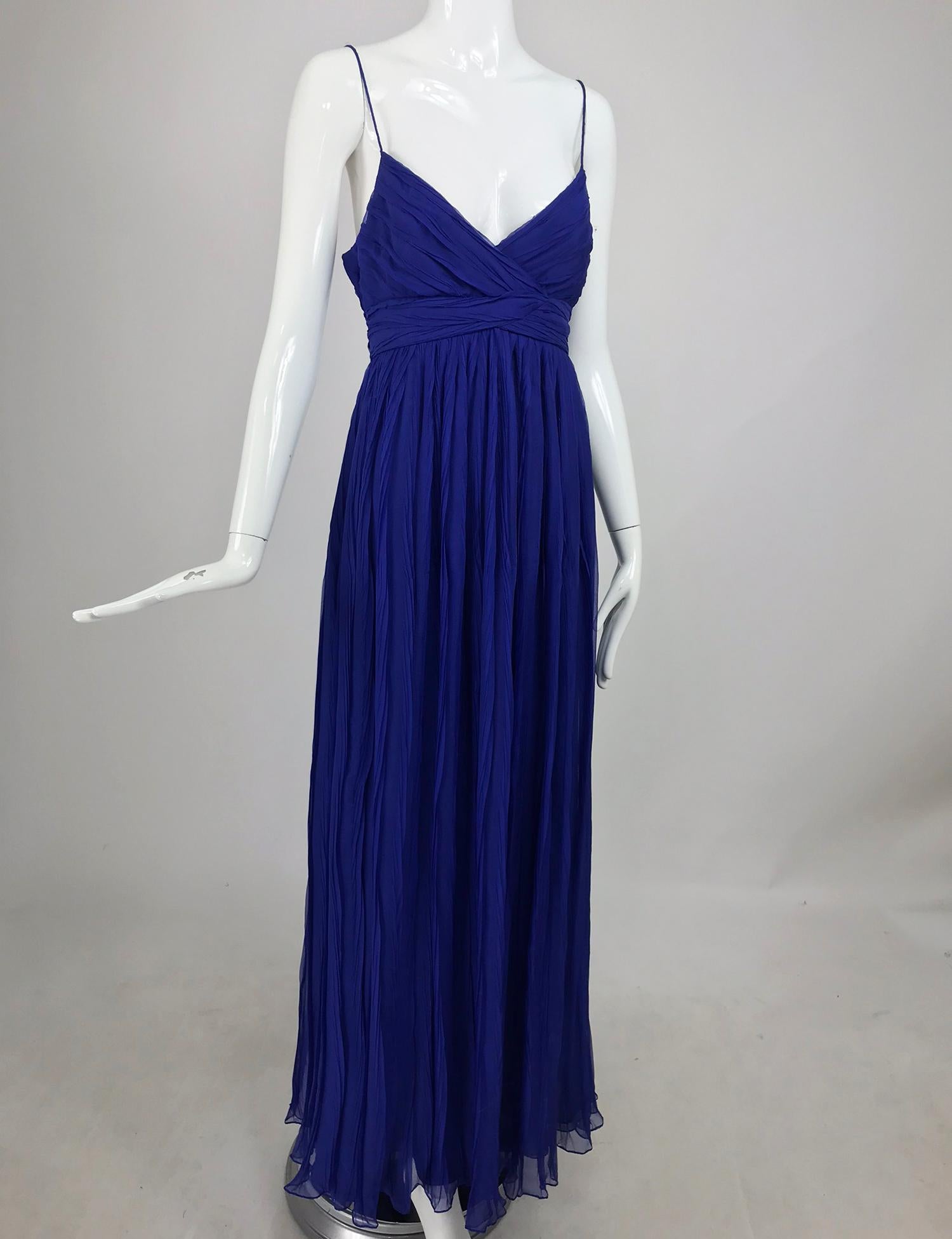 Jay Ahr pleated blue silk evening gown. This is such a gorgeous shade of blue a cross between cornflower and sapphire. The sheer silk is irregularly pleated giving interesting texture and dimension. The bodice is crossed at the front and the upper