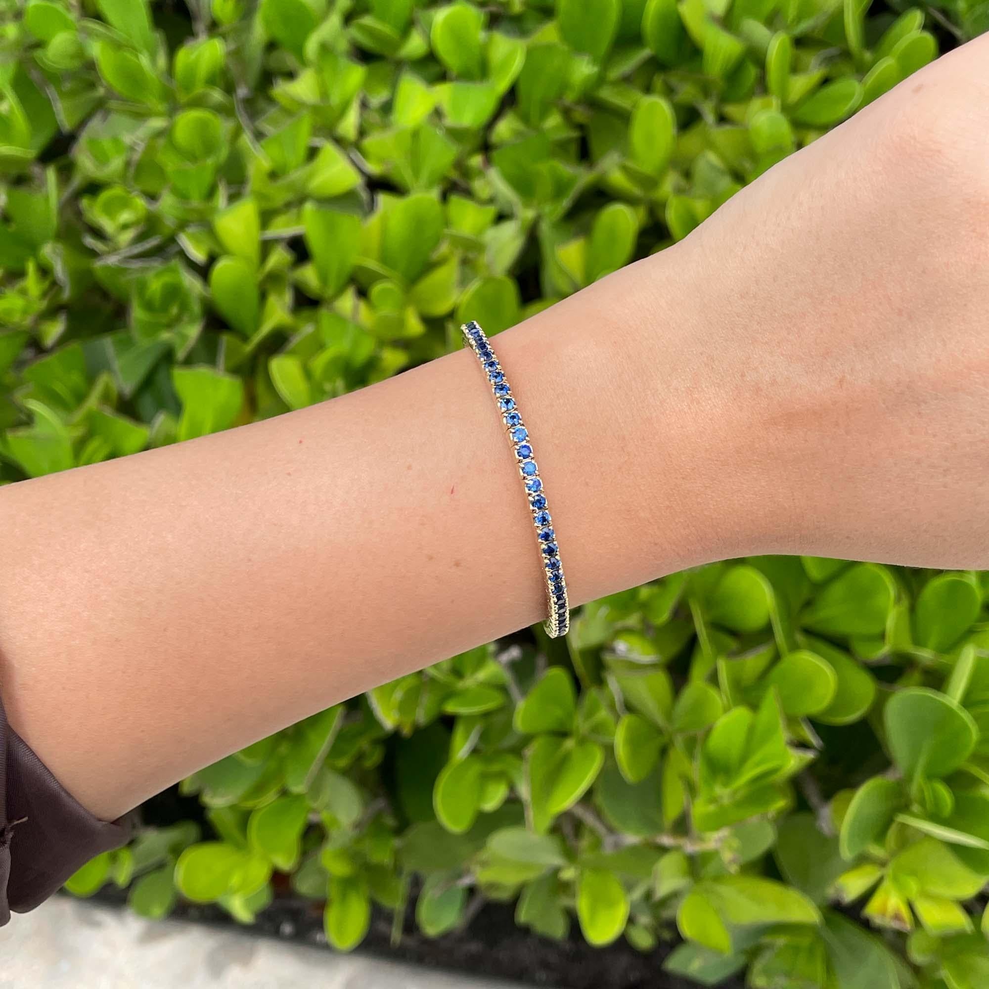 Women's or Men's Jay Feder 14k Yellow Gold Blue Sapphire Stretch Tennis Bangle Bracelet For Sale