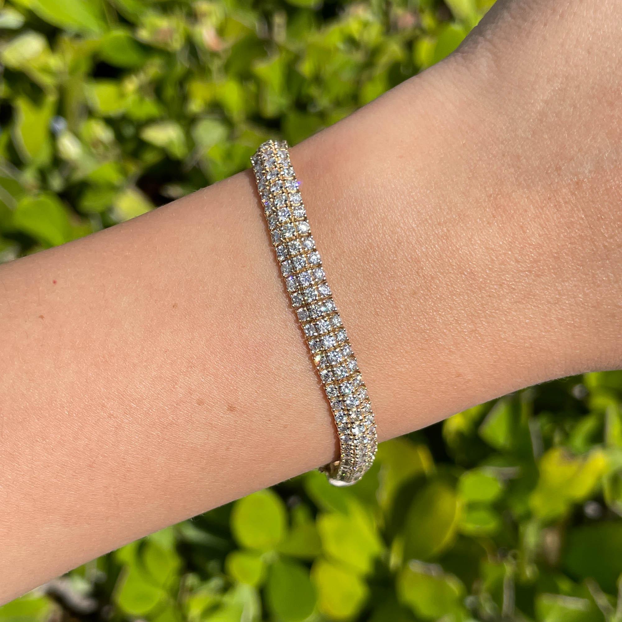 Jay Feder 14k Yellow Gold Diamond 3 Row Tennis Bracelet

Set with 213 round cut diamonds; total carat weight is 8.05ctw.

The bracelet is 7 inches long and 6.23mm wide. Total weight is 17.6 grams.

Please view our photos and videos for more