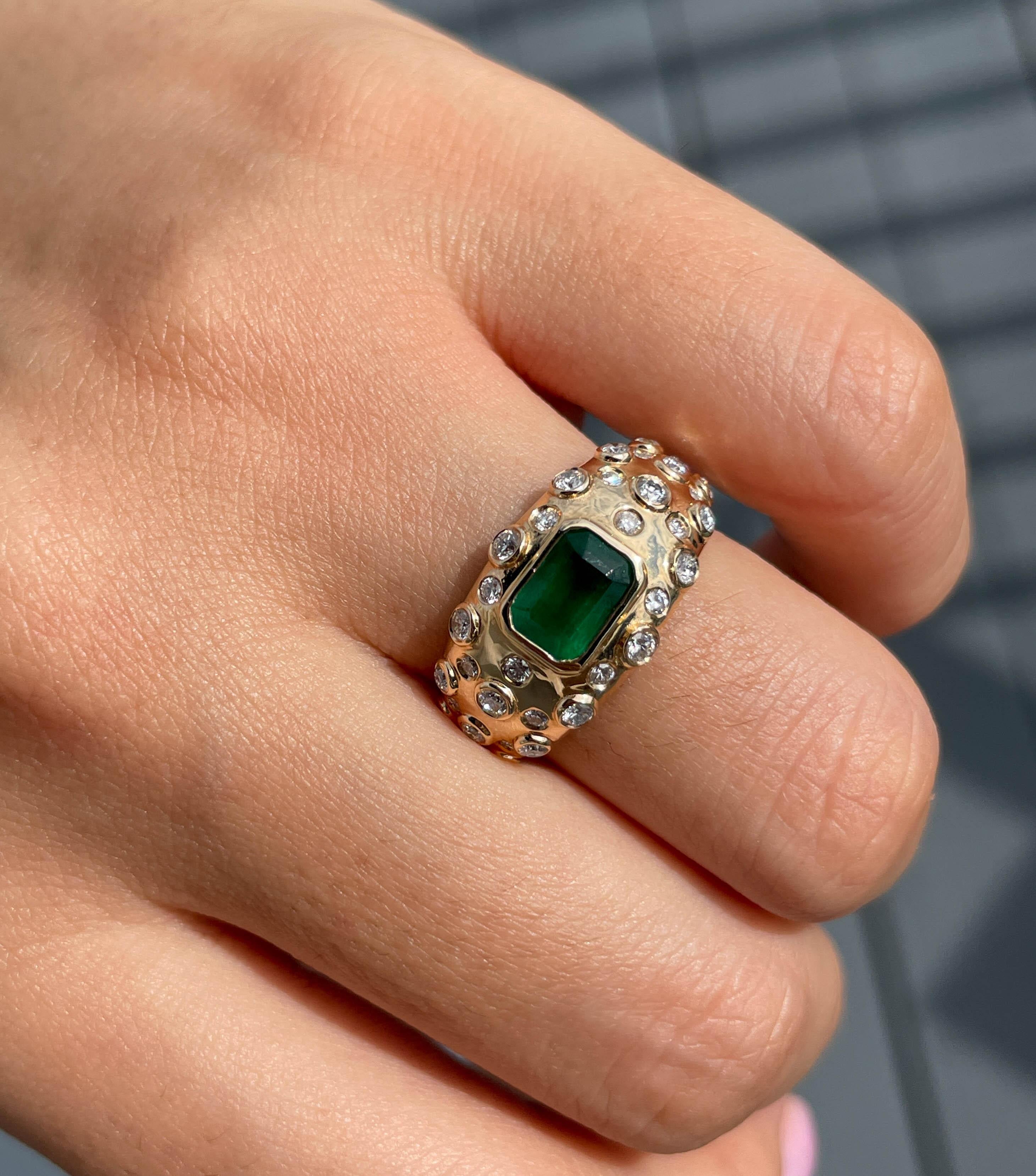 Jay Feder Green Emerald and Diamond Vintage ring in 14k Yellow gold with Step cut Green Emerald in the center weighing approximately 1.09ct. Set with small round diamonds; estimated total weight is 0.39ctw; G-H color and VS-SI clarity overall.

The