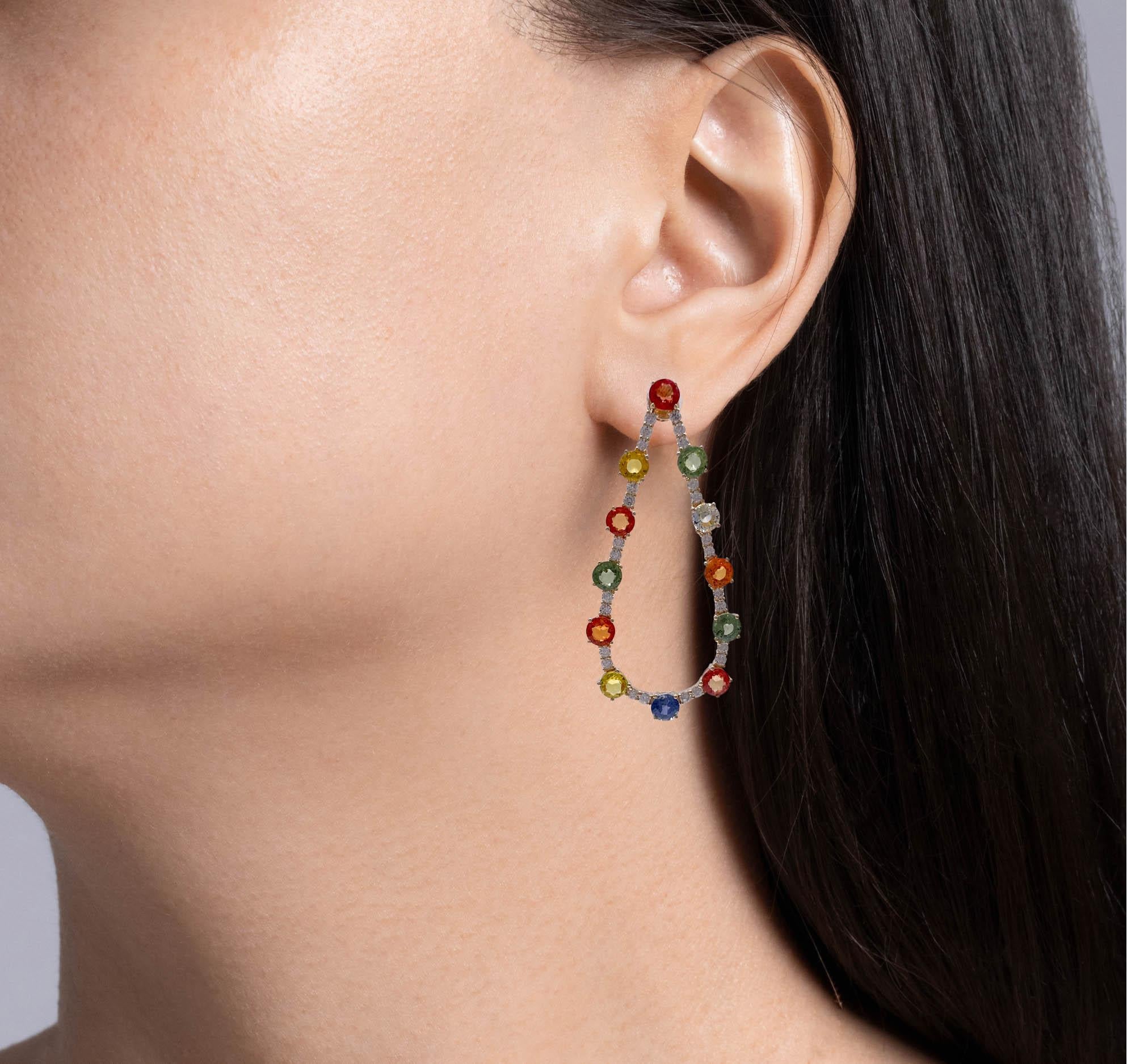 Jay Feder 14k Yellow Gold Multi Sapphire and Diamond Teardrop Shaped Earrings

Set with 24 round multicolored sapphires (13.16ctw) and 52 round brilliant diamonds (1.61ctw). 

The width tapers from 4.75mm to 24.95mm on the bottom. Earrings are 2