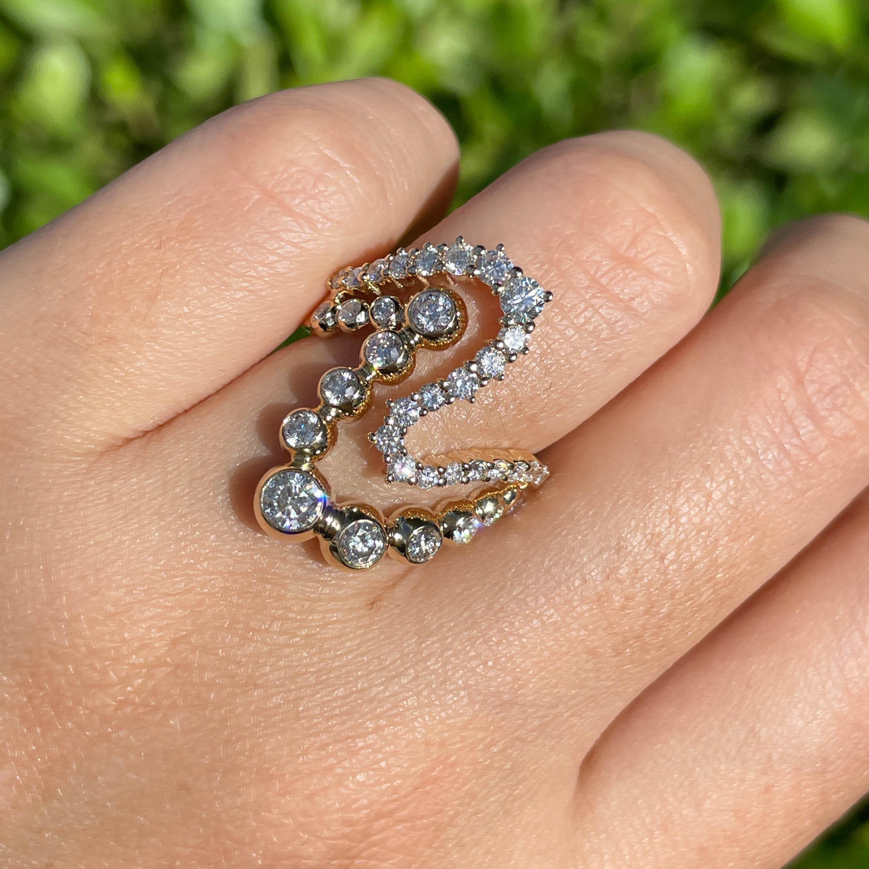 Jay Feder 14k Yellow Gold Diamond Bezel ZigZag Ring

There are bezel and prong set round diamonds; total carat weight is 1.89 carats.

Sits 3.87mm from the top of the finger; the top's north-south is 24.79mm. The band tapers from 4.48mm on the top