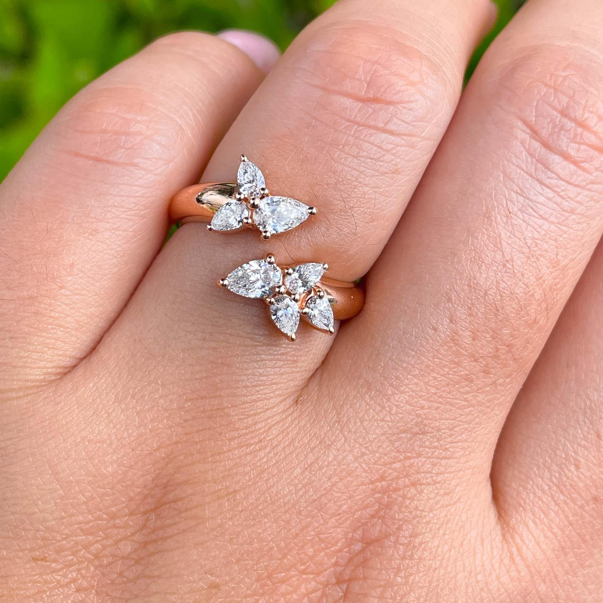 Jay Feder 18k Rose Gold Diamond Crossover Wrap Ring

Set with pear shaped diamonds; total carat weight is 0.86ct. 

The tops measurements are 11.24x14.73mm. The band tapers from 3.83mm to 2.82mm on the bottom. Sits 3.78mm from the top of the finger.