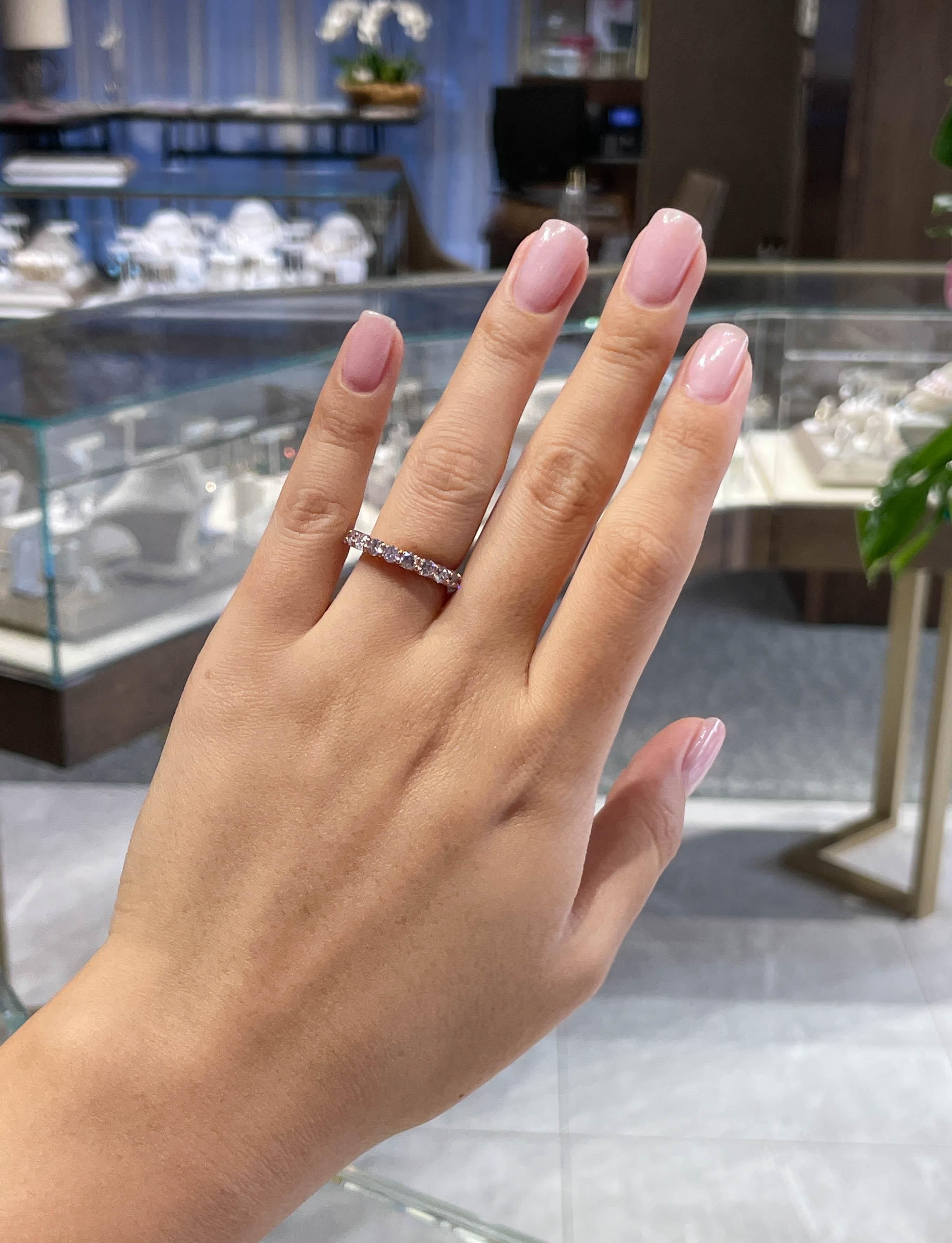 shared-prong eternity band with a trellis design.