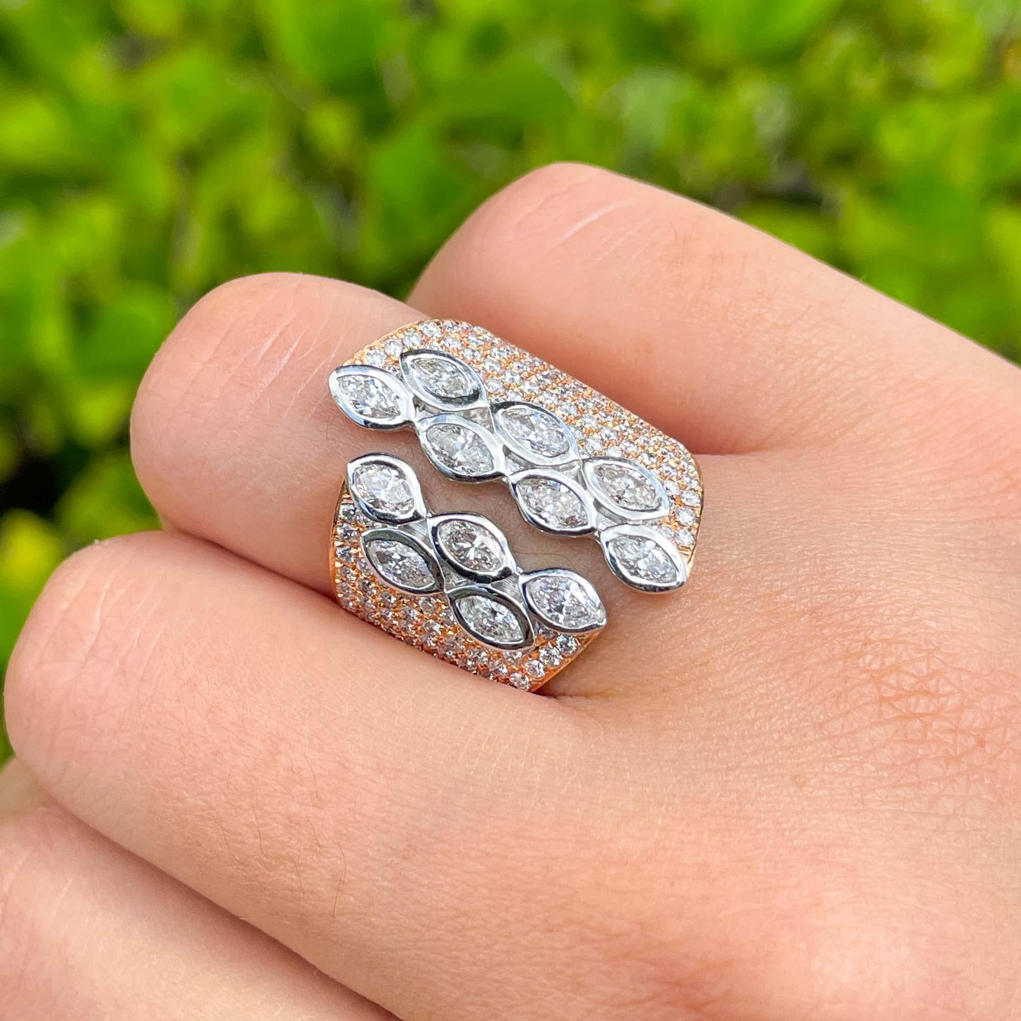 Jay Feder 18k Two Tone Gold Diamond Cocktail Ring

Set with marquise shaped and round brilliant diamonds; total carat weight is 2.37ct. 

The width of the ring is 24.04mm on the top and 5.84mm on the bottom. Sits 2.95mm from the top of the finger.