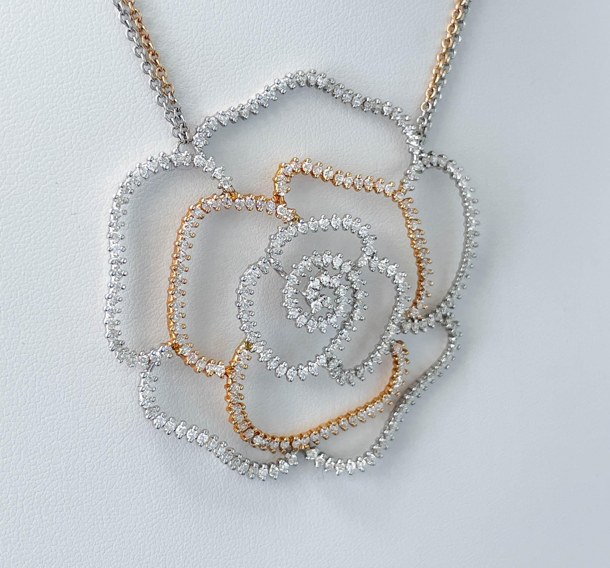 Jay Feder 18k Two Tone Gold Diamond Open Flower Necklace
There are 288 round shaped diamonds; estimated total weight is 3.85 carats.
The necklace is 16.5 inches long plus pendant drop is 2.25 inches.
The pendant’s measurements are 2.25x2.25