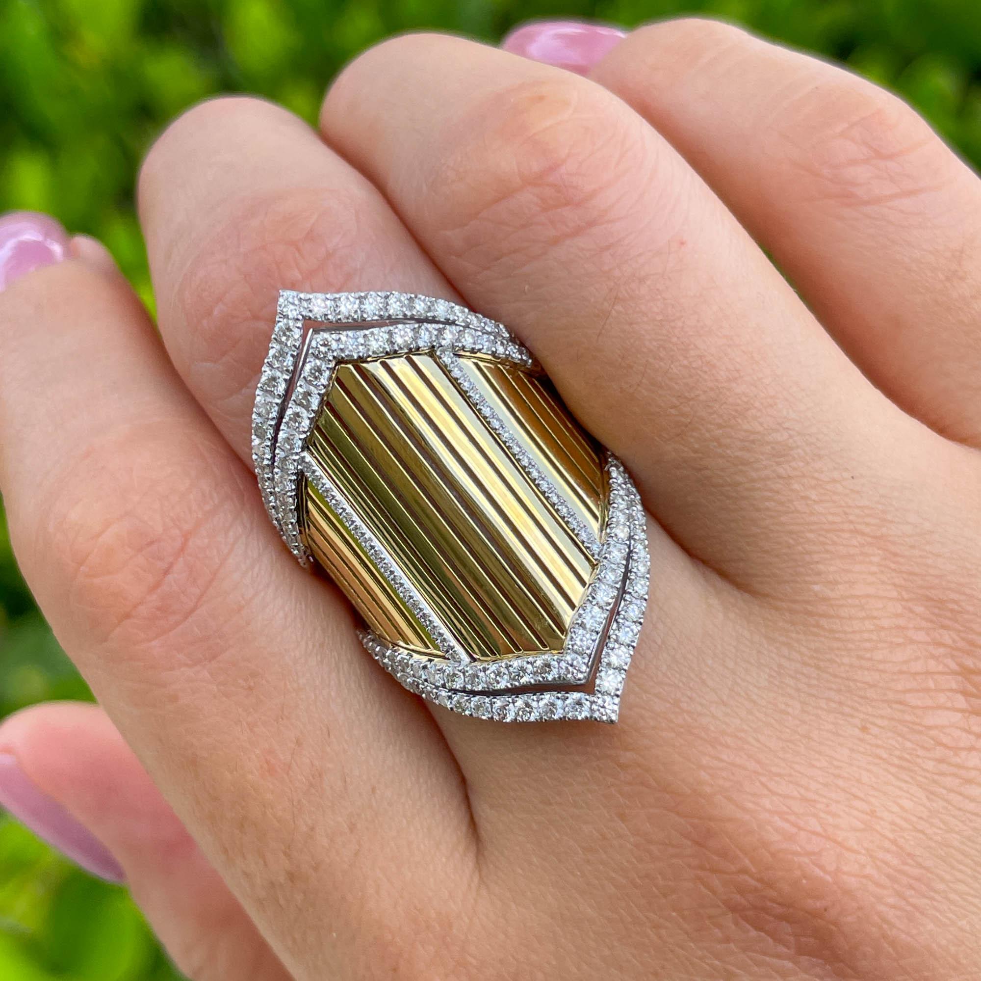 Jay Feder 18k Two Tone Gold Diamond Samba Ring; total weight of all diamonds is 1.30 carats.

The top's North-South measures to 34mm. The band is 3.36mm on the bottom. Sits 3.67mm from the top of the finger. The ring size is 5.75 (please contact for