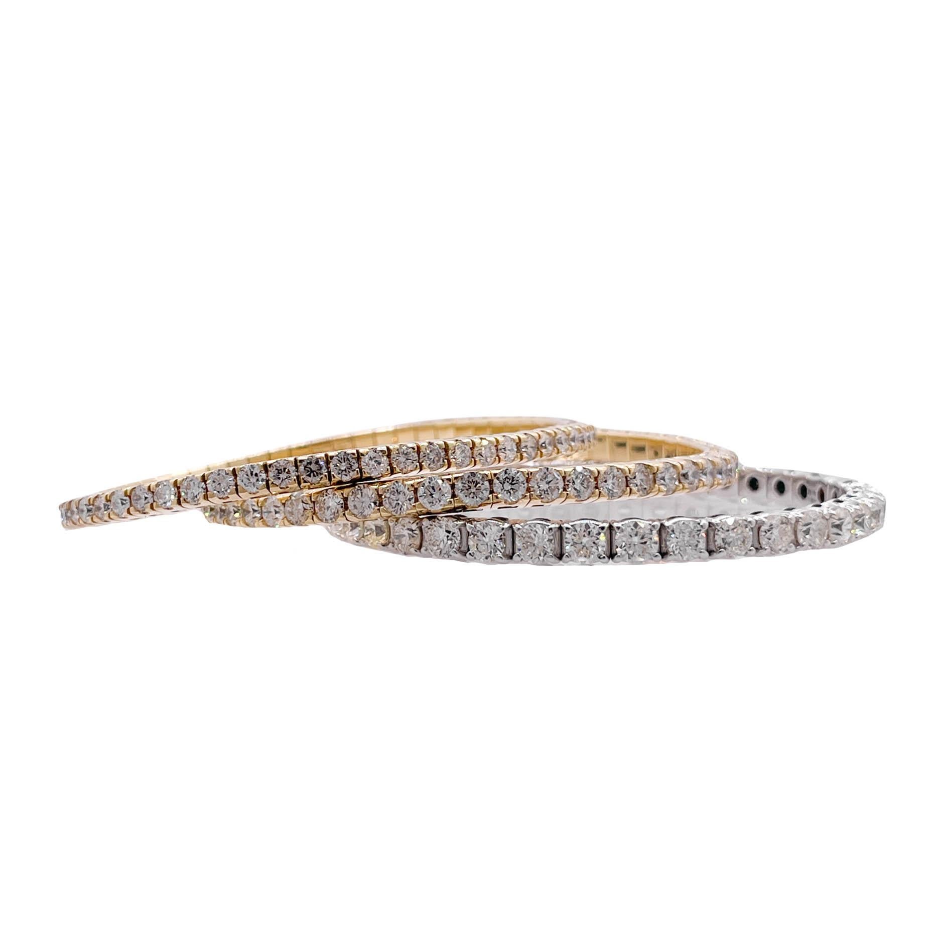 Jay Feder 18k White Gold Diamond Stretchy Tennis Bangle Bracelet

Set with 39 round diamonds; total carat weight is 9.75ctw.

The bracelet is 2.5 inches in diameter and 4.23mm wide. Total weight is 20.6 grams.

Please view our photos and videos for
