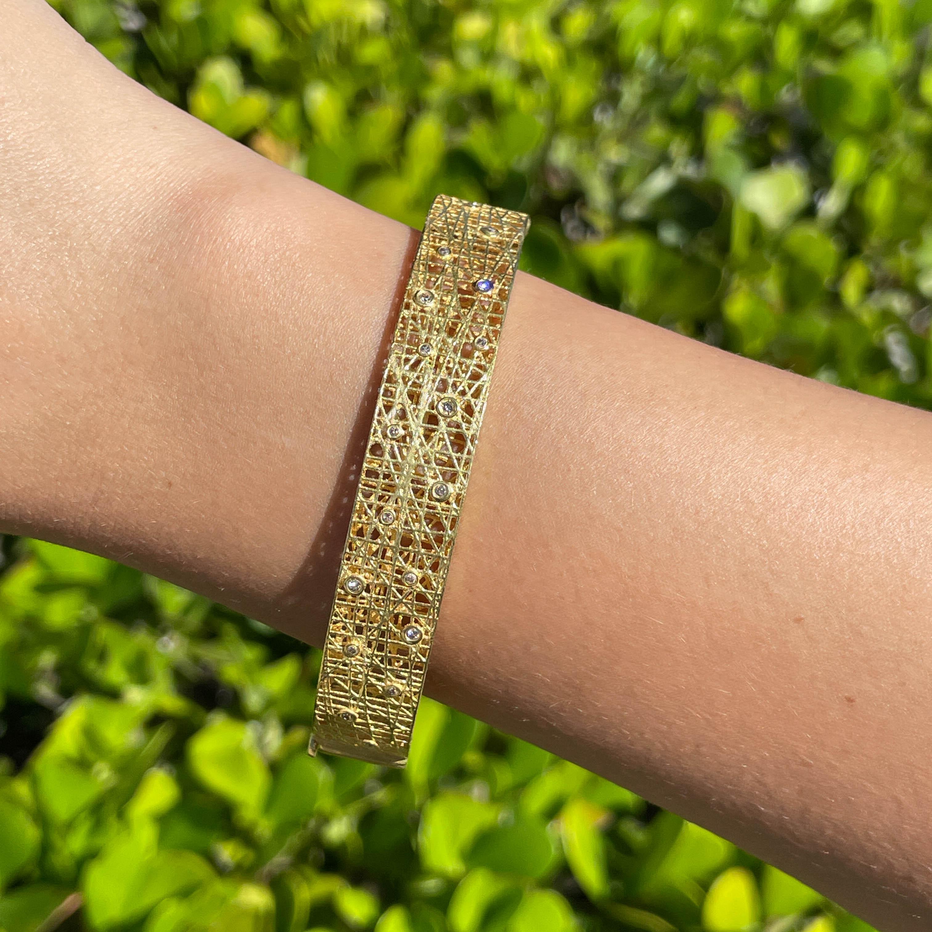 Jay Feder 18k Yellow Gold Diamond Lace Bangle Bracelet

Set with 0.35ctw round brilliant diamonds. The bangle is 2.75inches in diameter and 12.08mm wide. Total weight is 20.2 grams. 

Please view our photos and videos for more details.

Good