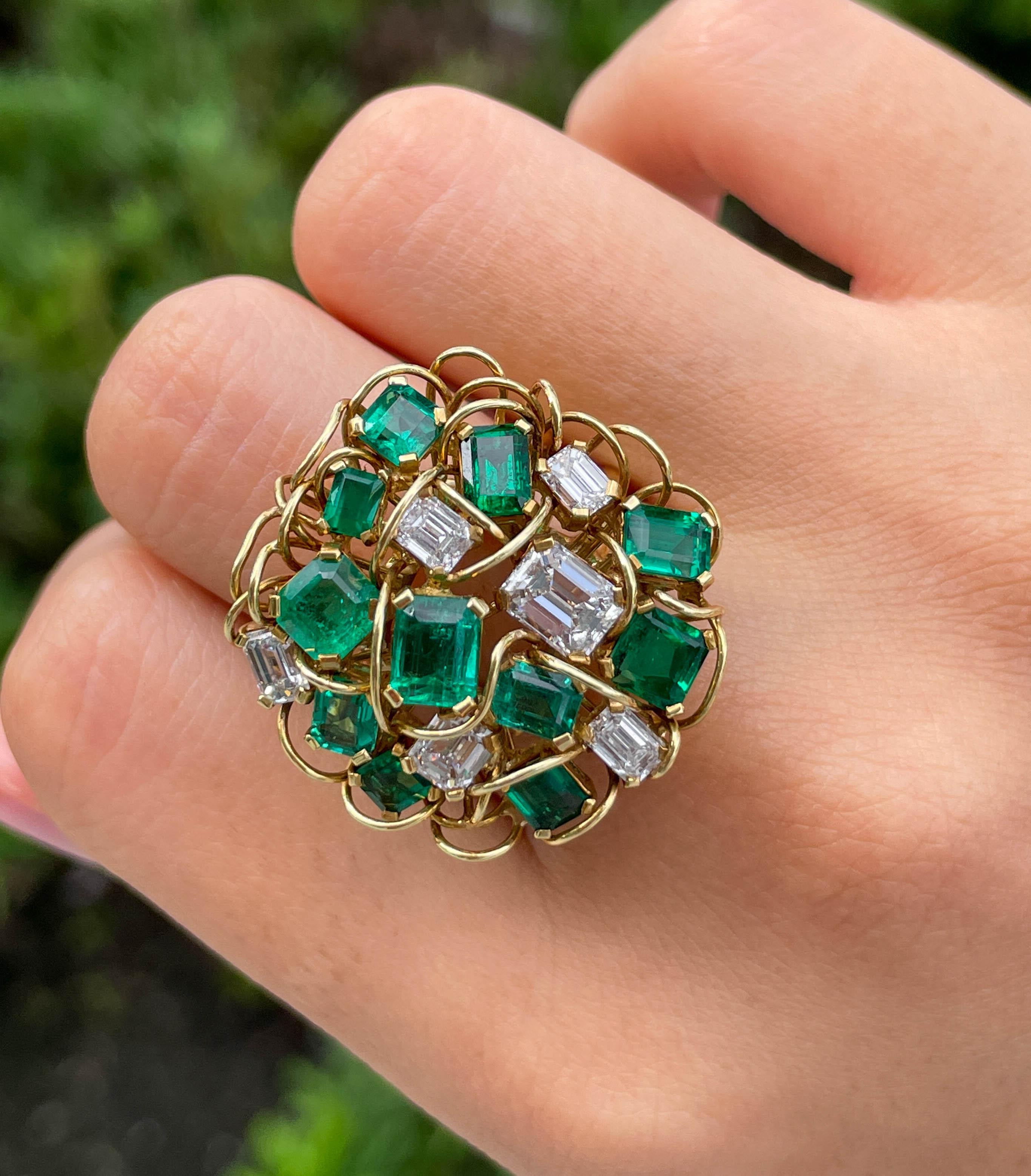 Jay Feder Green Emerald and Emerald cut Diamond ring in 18k Yellow gold 
There are 11 Green Emeralds (7.70 carat total) and 6 Emerald cut diamonds (6.0 carat total).
The top’s measurements are 22x22mm. The band’s width tapers from 9.49mm to 3.92mm