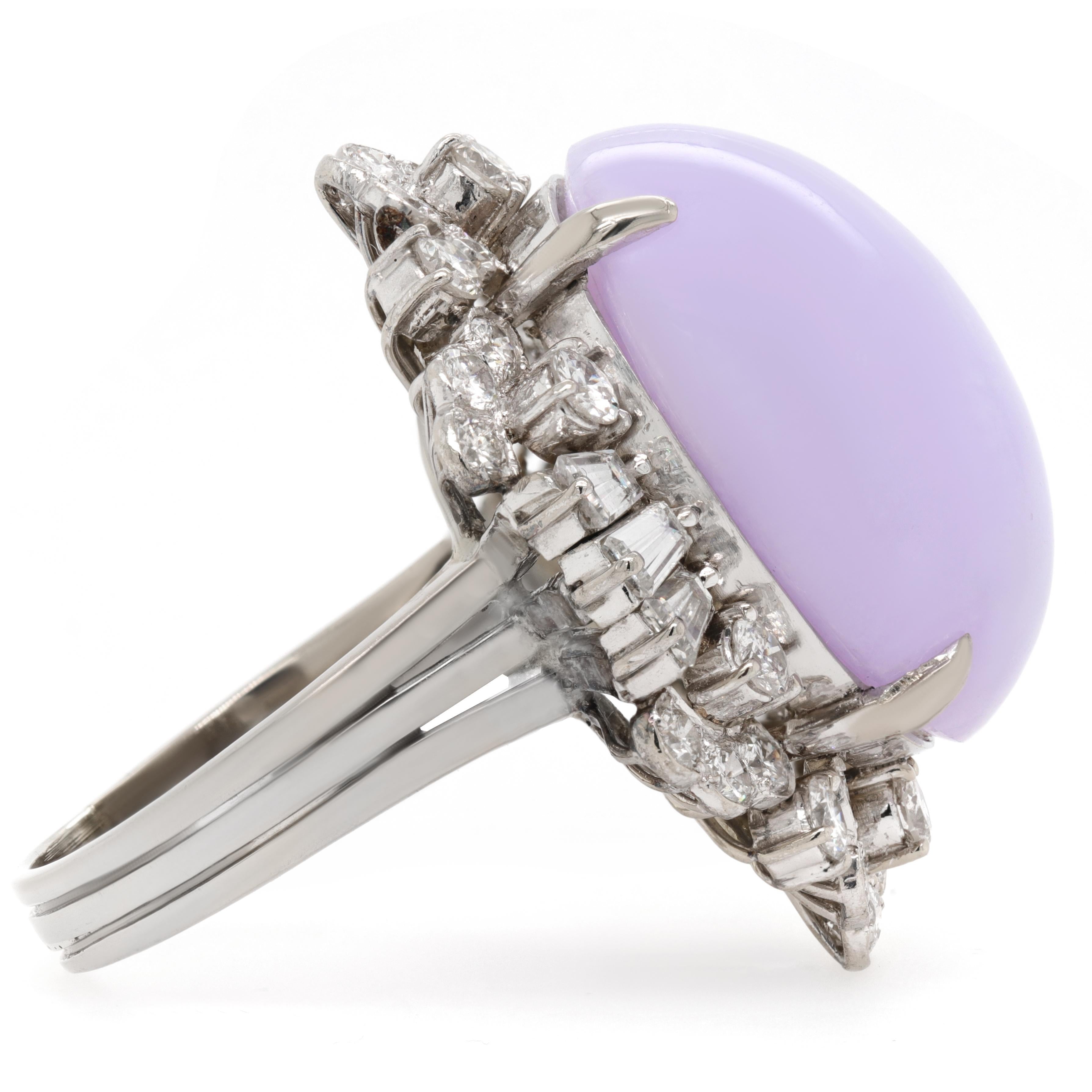 Jay Feder Lavender Jade and Diamond Ring in 14k White gold. The center stone is Cabochon shaped Lavender Jade.
It is surrounded with tapered baguette and round diamonds; estimated total weight is 3.00ct; F-G color and VS2-SI1 clarity overall.
The
