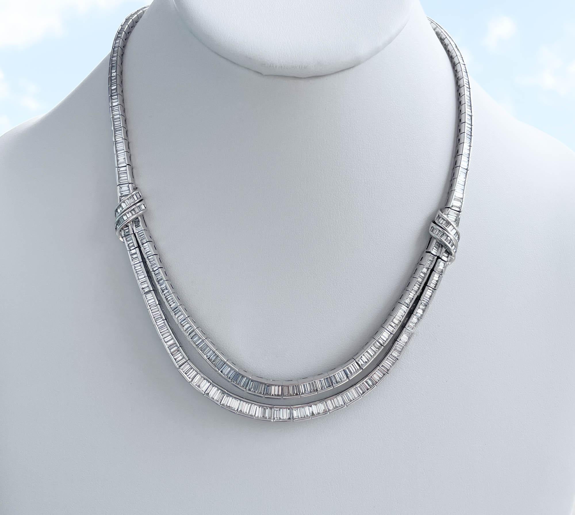 Jay Feder Platinum Diamond Collar Necklace
Set with baguette cut diamonds; estimated total weight is 16.35ctw.
The necklace is approx. 17 inches long. The total weight of the necklace is 84.8 grams.

Please view our photos and videos for more