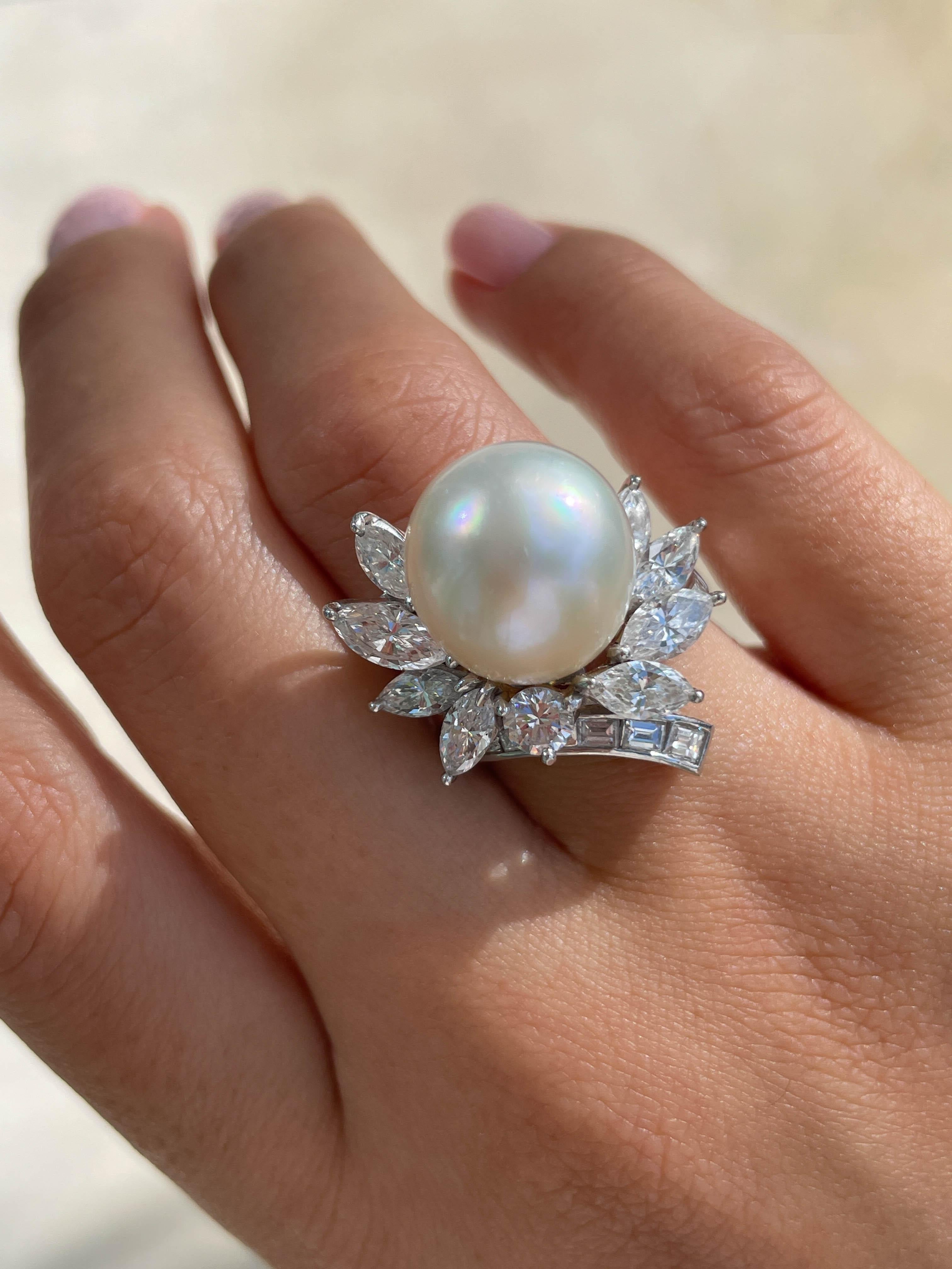 Jay Feder Pearl and Diamond ring in Platinum with 13mm South Sea Pearl in the center set with marquise, round and straight baguette diamonds; estimated total weight is 2.64ctw. 

The top’s measurements are 25x23mm. The band’s width tapers from