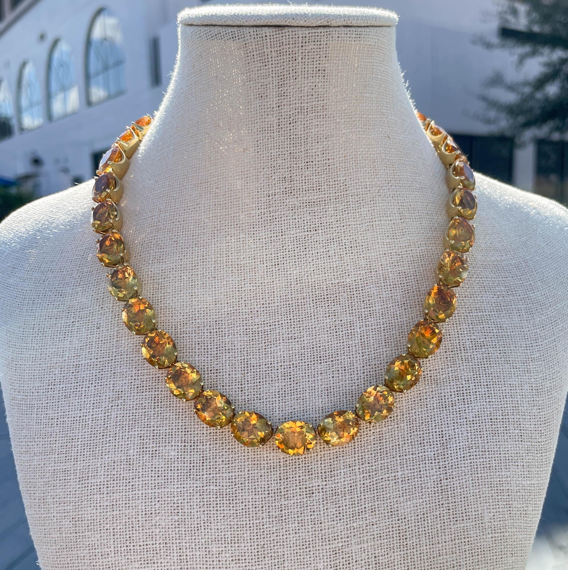 Jay Feder Vintage 18k Yellow Gold Oval Citrine Tennis Necklace
There are 34 Oval shaped citrines; estimated total weight is 137.7 carats.
The necklace is 17 inches long. Total weight of the necklace is 78.5 grams.

Please view our photos and videos