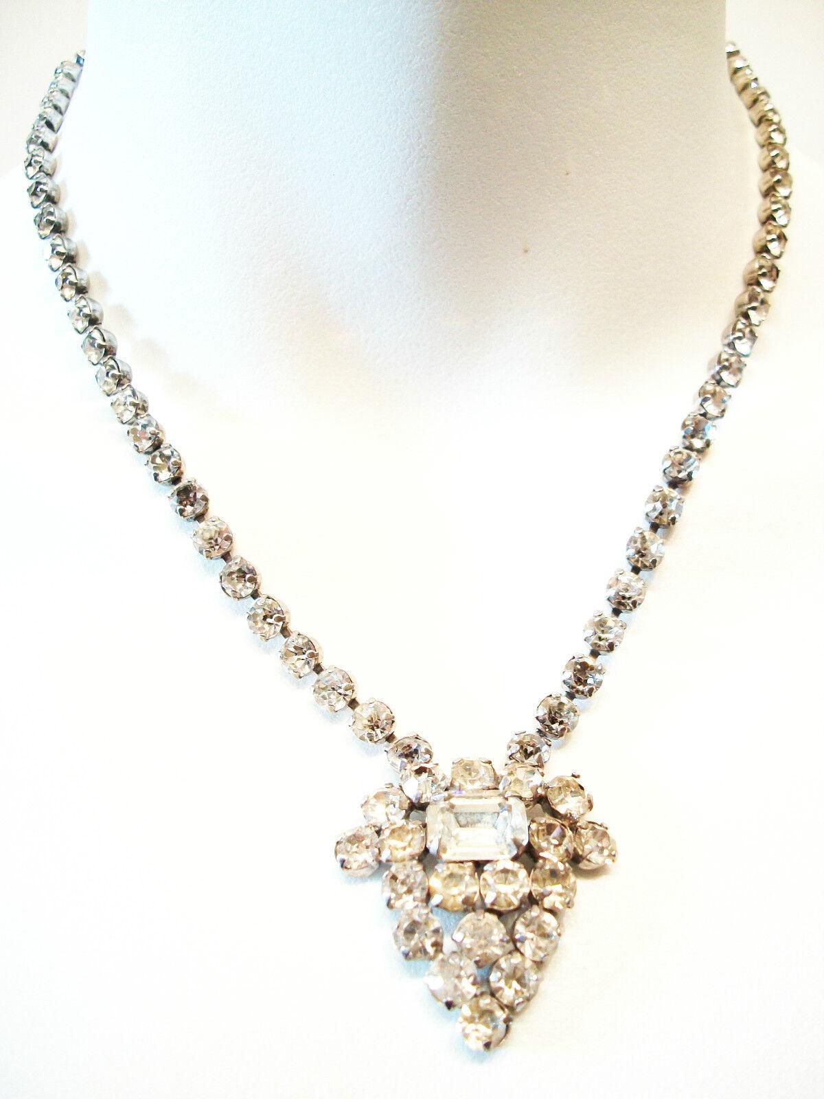 JAY FLEX - Art Deco antique sterling silver and rhinestone necklace - featuring a palmette designed pendant with a central baguette crystal - signed on one of the mounts - also marked STERLING on the same mount - Canada (Montreal - Quebec) - circa