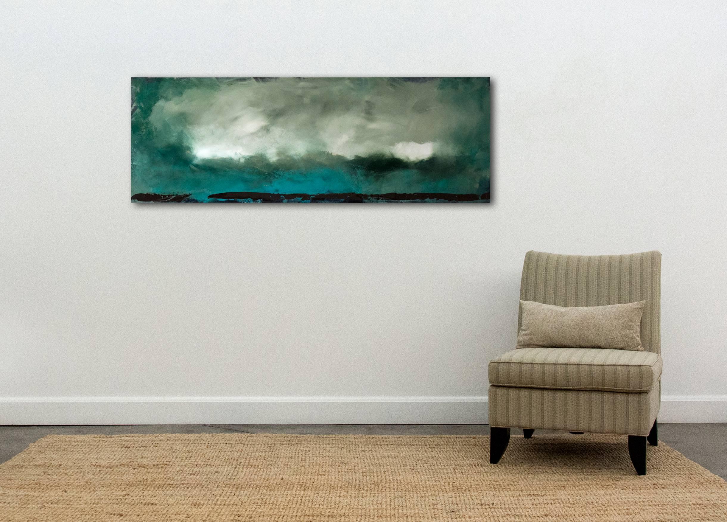 A vast, stormy cloud advances through an azure sky in this moody landscape by Jay Hodgins. Layers of curated colors coated in a glossy resin create depth and light in this atmospheric painting. This work is part of the Rujuh series. Rujuh is