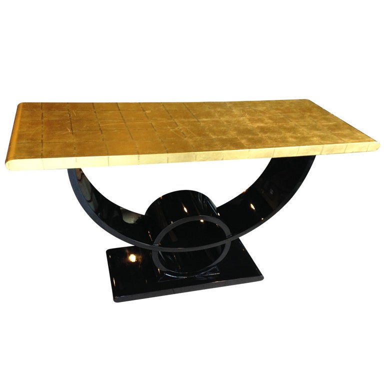 Deco inspired console with black lacquered base and 24-karat gold leafed top. For Century Furniture.