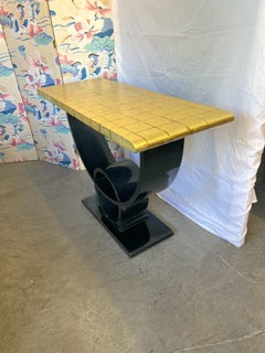 Mesa consola Jay Spectre en pan de oro y laca negra