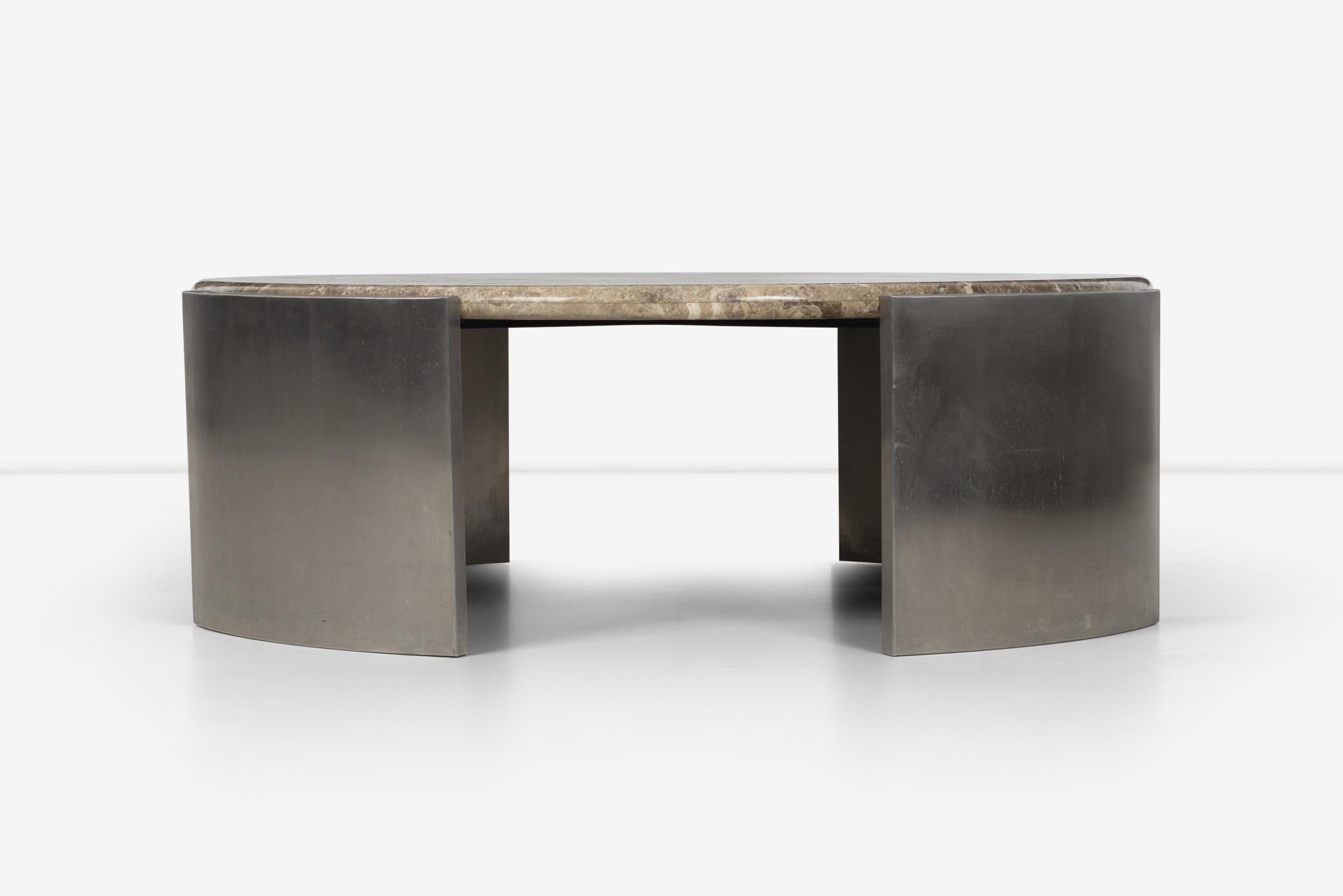 Jay Spectre custom coffee table, solid marble with bull-nose edge, custom inlaid stainless steel and stainless steel legs connected cradle for marble placement.
Measures: Diameter of marble is 48