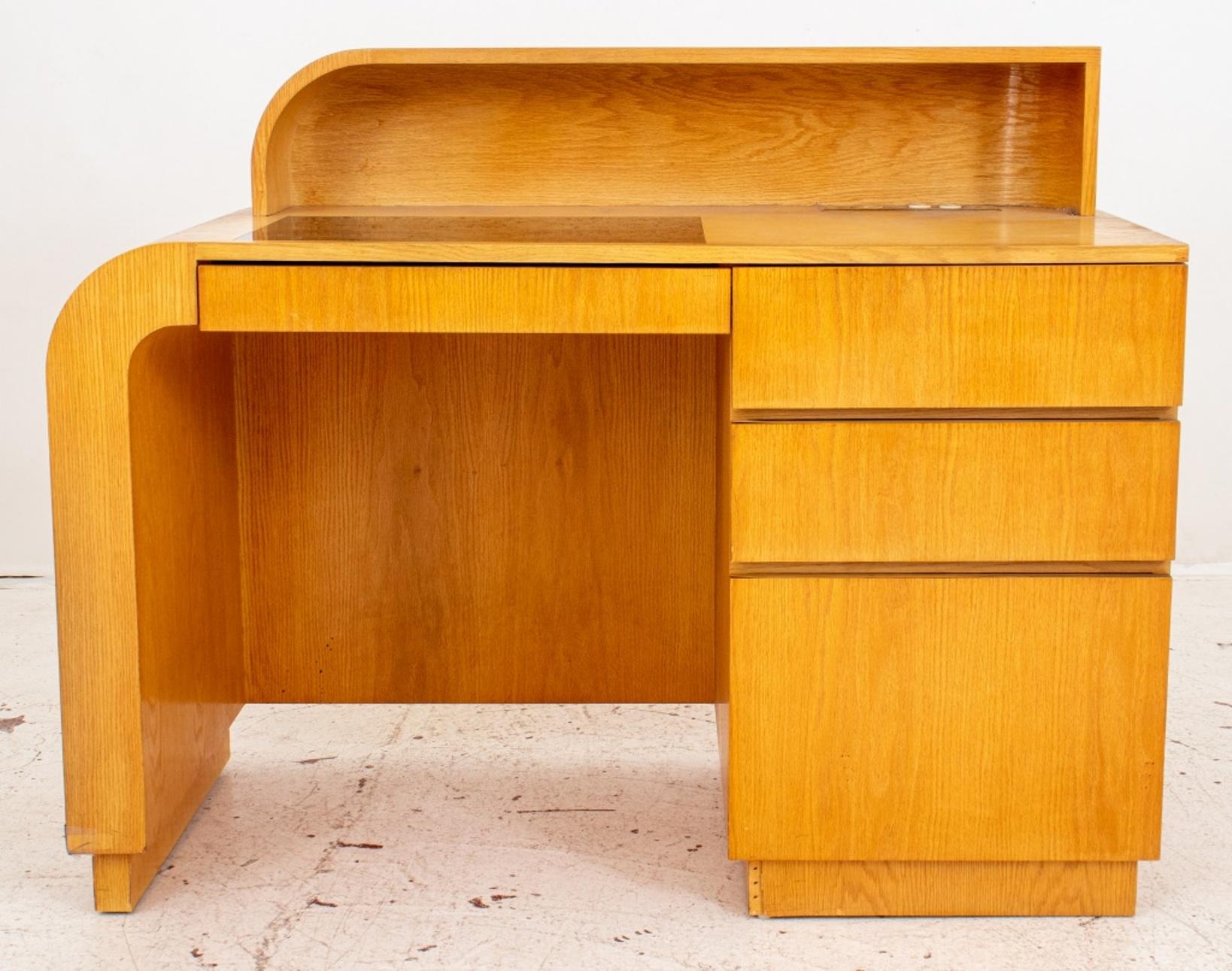 Jay Spectre (American, XX-XXI) for Century Furniture, Art Deco manner oak desk inspired by Donald Deskey, rectangular with left waterfall sides above four short  drawer. 1980s. 

Dimensions: 38
