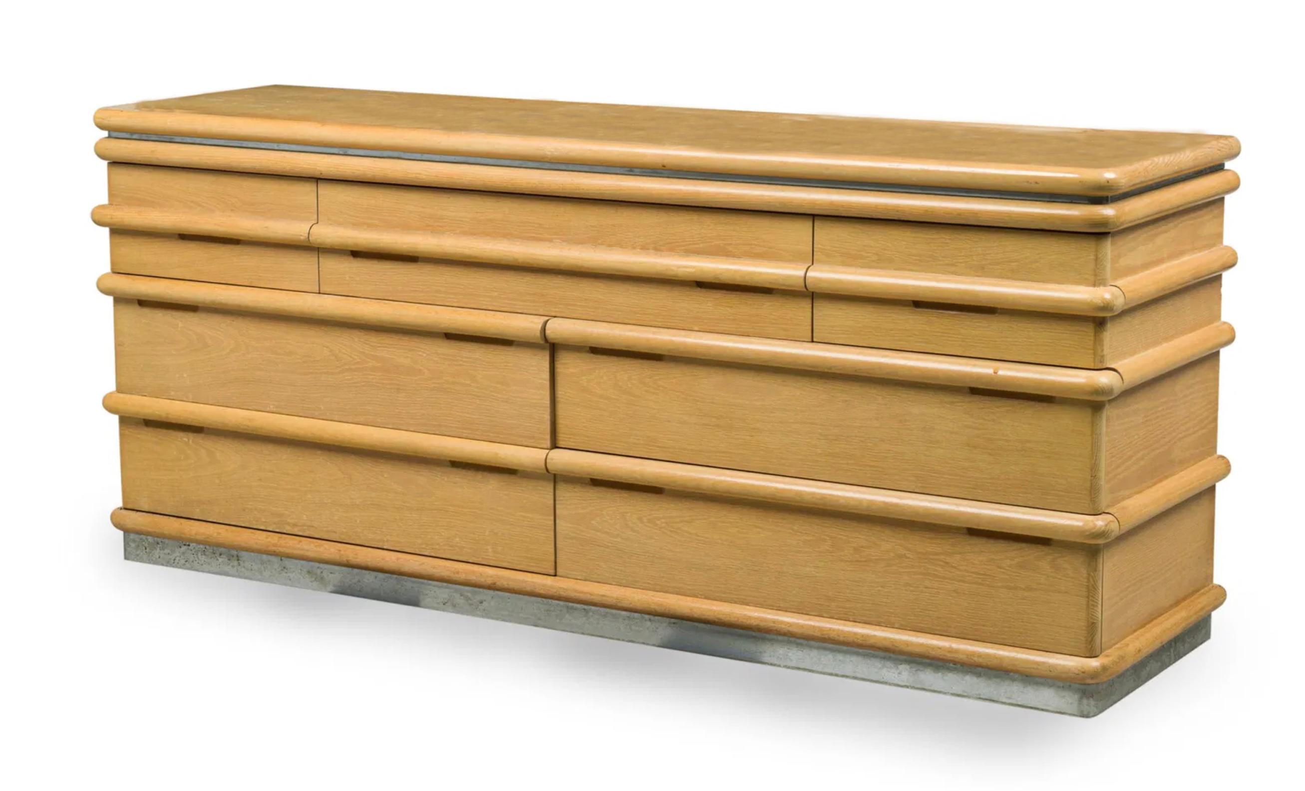 Jay Spectre bleached oak veneer 7 drawer Dresser with ribbed drawer pulls, resting on a chrome plinth, Made by Century Furniture c. 1980s Made in USA. Labeled in Drawer - Has original Tags inside.

Measures - 72