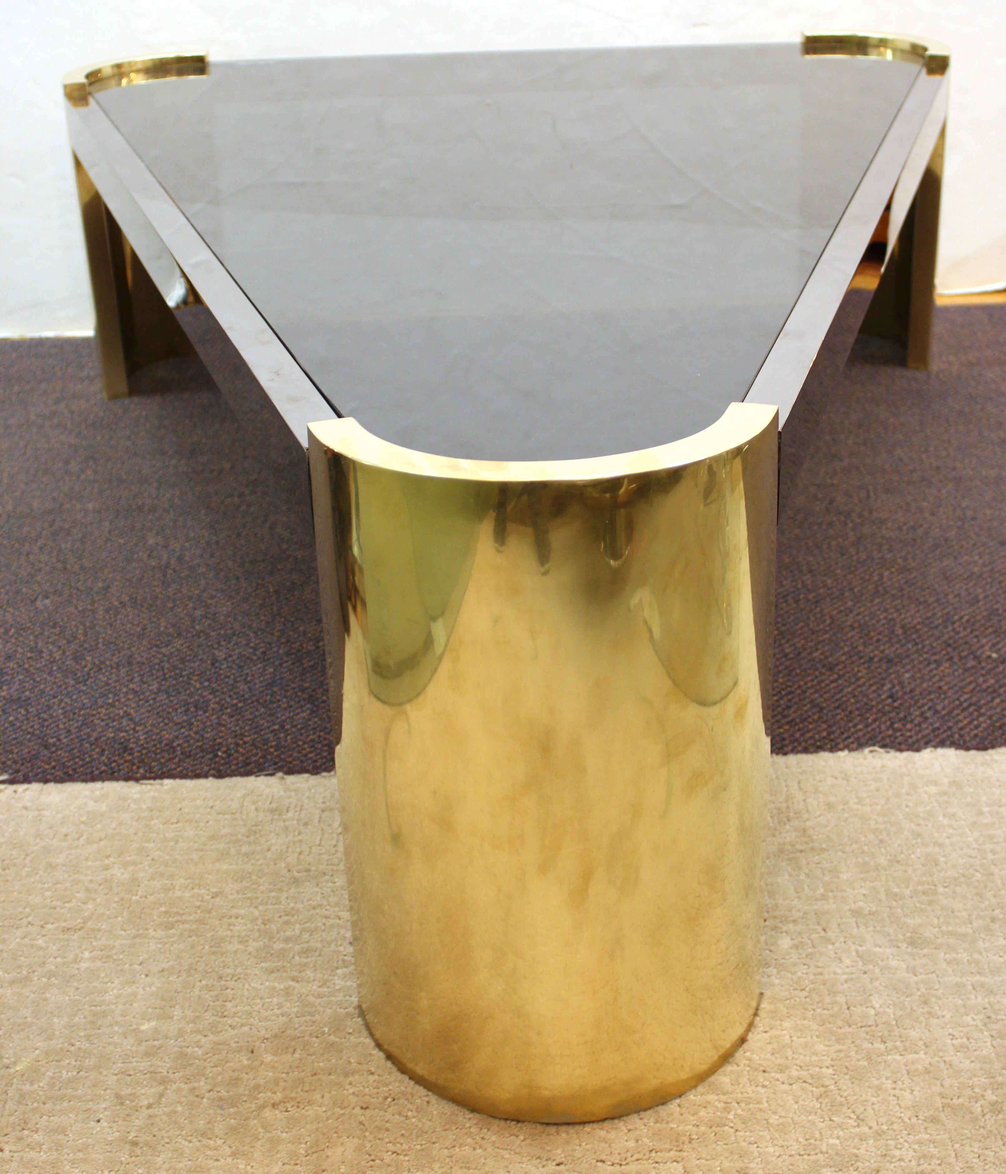 Jay Spectre modernist triangular shaped cocktail or coffee table in metal frame with a glass top. The piece is in great vintage condition.