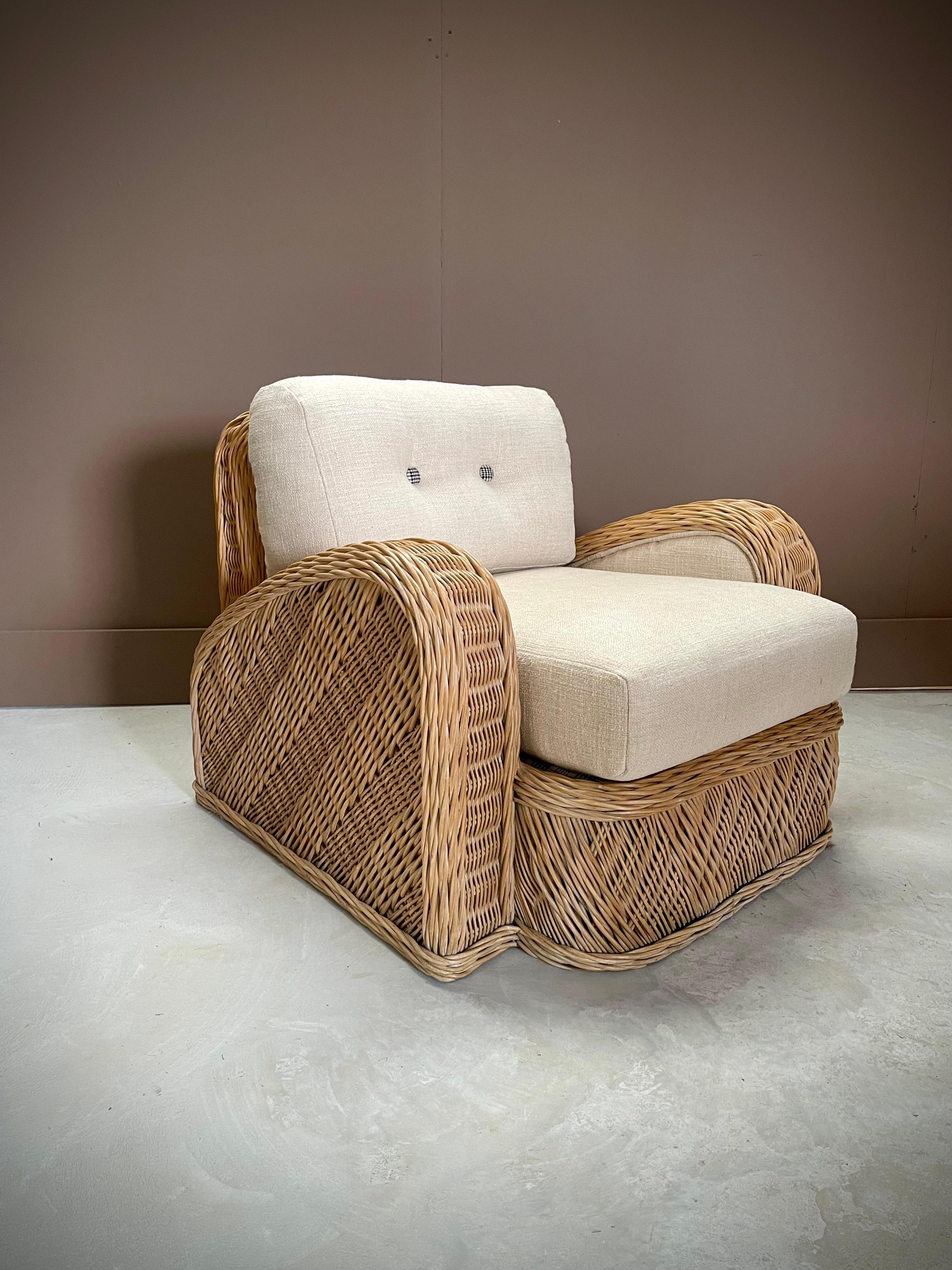Introducing the epitome of sophistication: the Postmodern Jay Spectre Wicker Chair. With its timeless curved arms and avant-garde design, this chair seamlessly blends modern flair with classic elegance. Crafted with performance fabric, it boasts