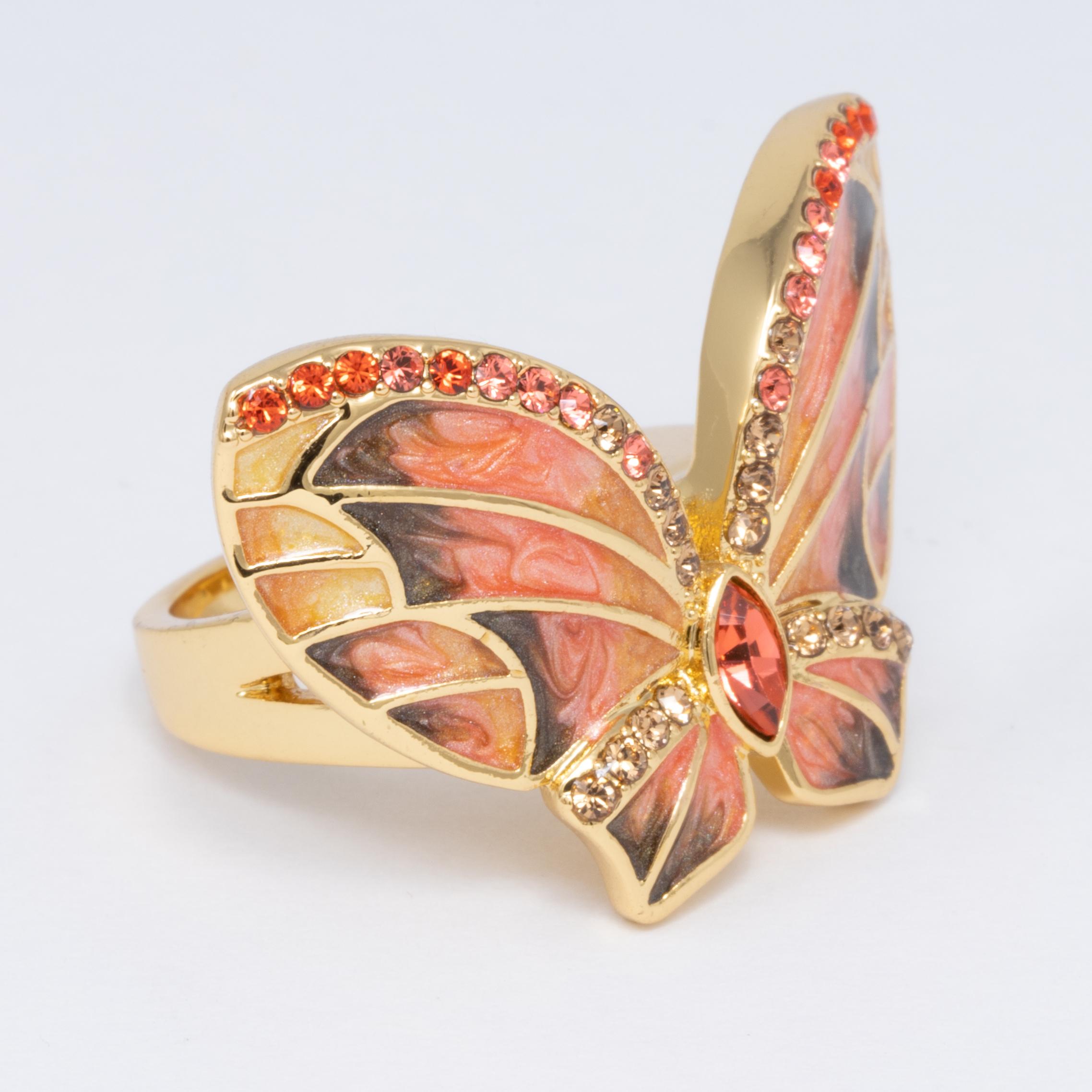 A colorful cocktail ring, featuring a butterfly painted in pink and yellow enamel and accented with sparkling crystals.

Ring size US 7.25

Crystals: Smoky topaz, amethyst, light siam

Hallmarks: Jay, Jay Strongwater, CN

By Jay Strongwater,