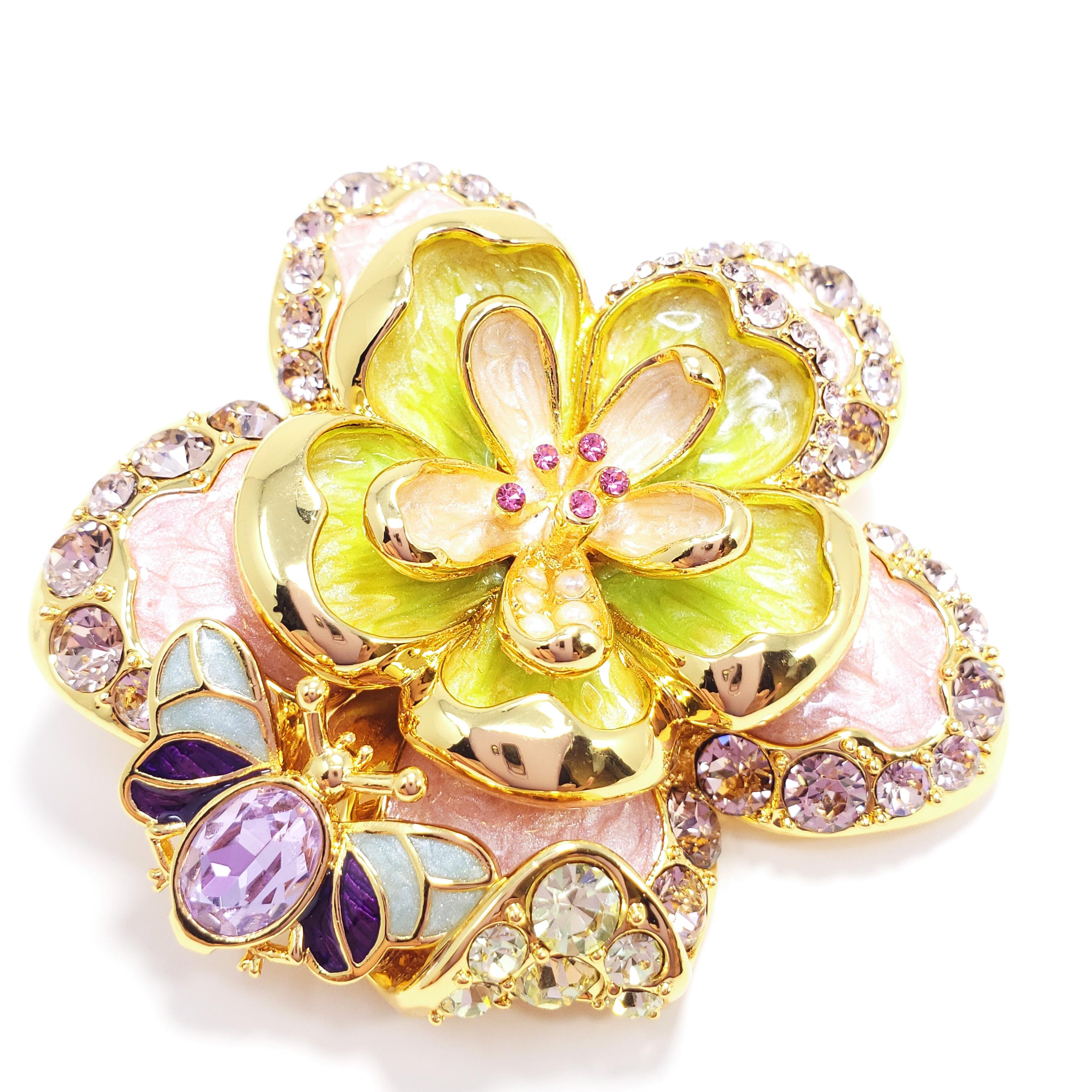 Flower power! An ornate floral motif featuring pink crystals & faux pearls. Painted with green and pink enamel, this colorful accessory can serve as either a pin/brooch or a necklace pendant.. Set on gold plated metal.

Hallmarks: Jay, Jay