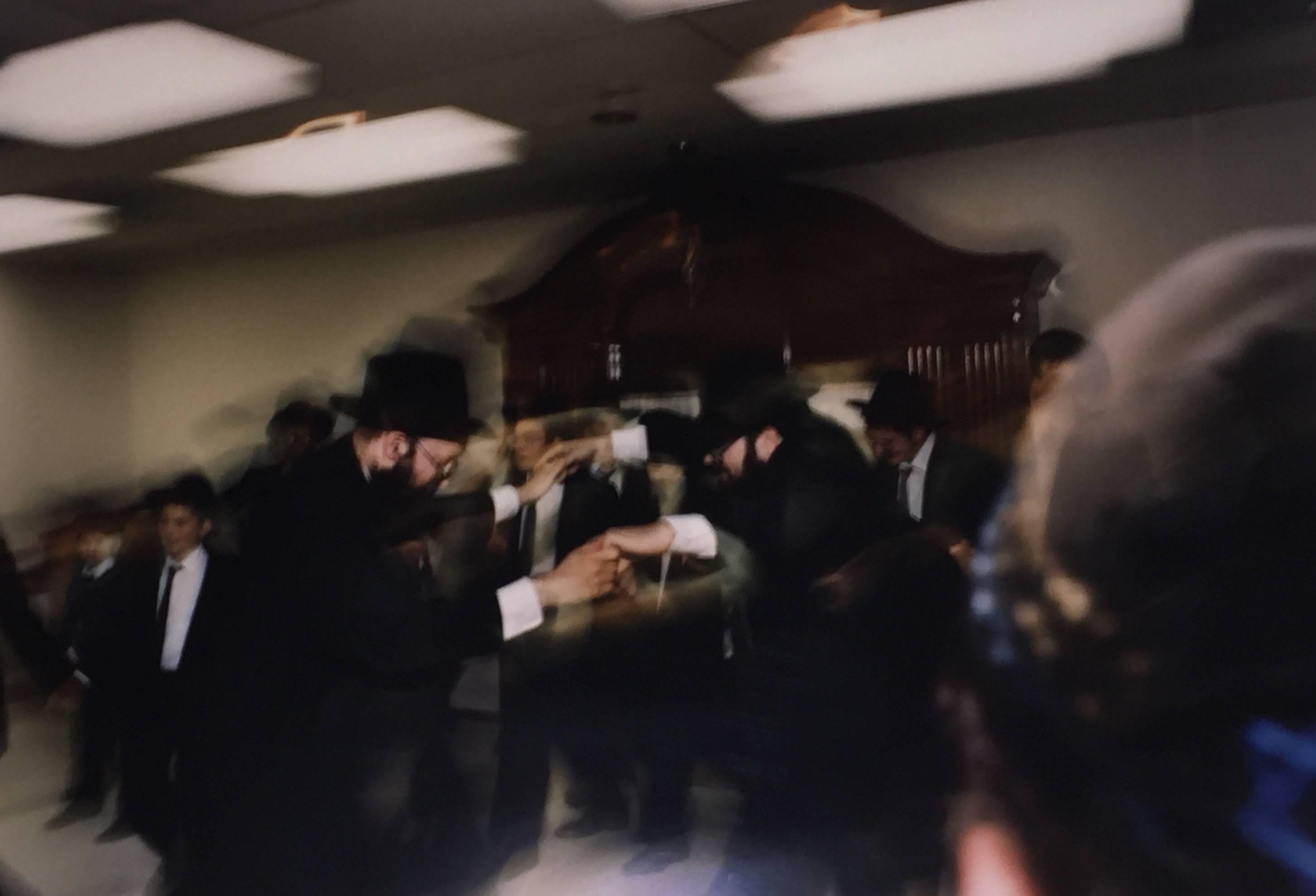Jay Wolke Figurative Photograph - Men Dancing, Migdal Torah, Chicago