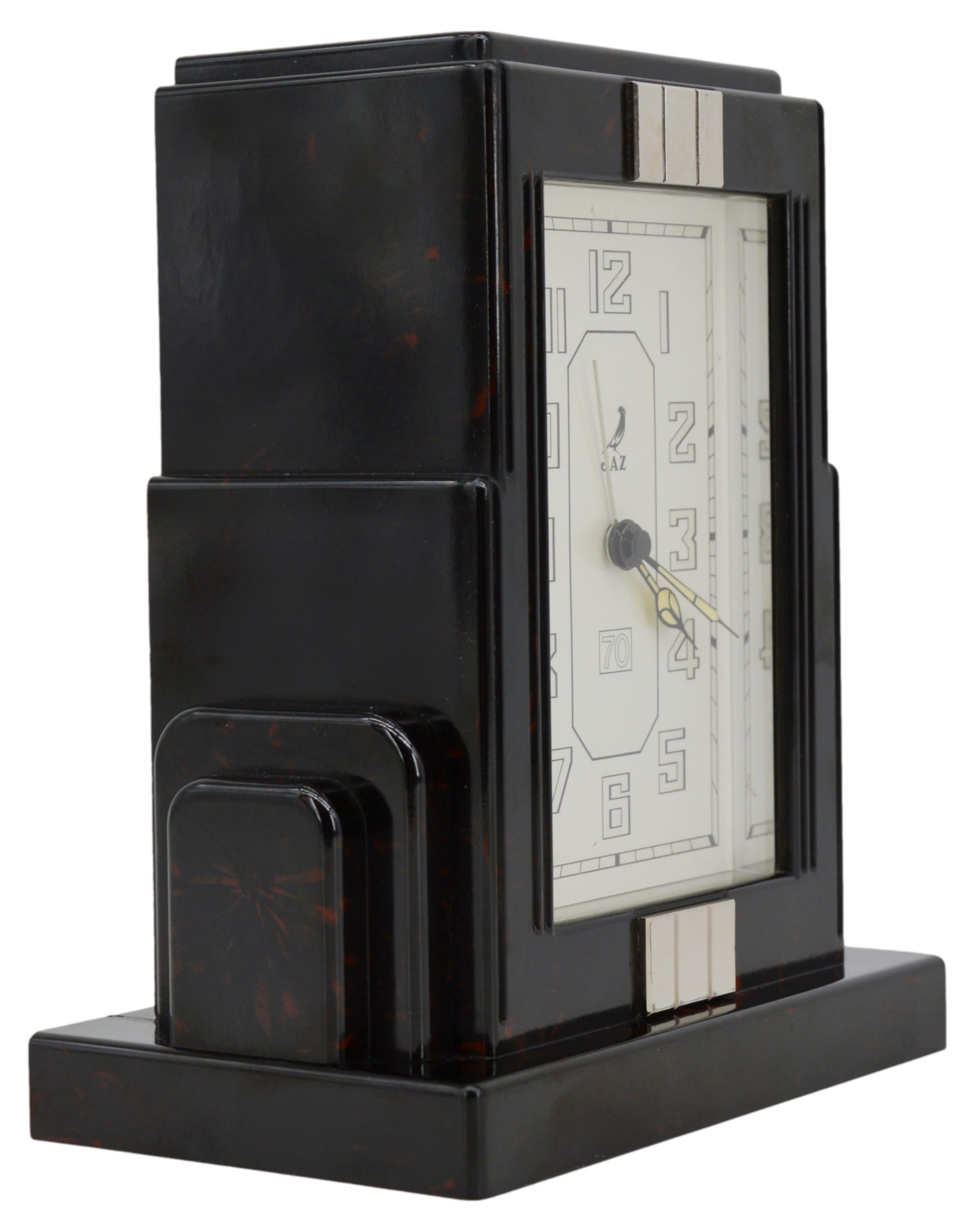 French Art Deco clock by JAZ, France, 1930s. Bakelite, metal and glass. Measures: Height: 6.4
