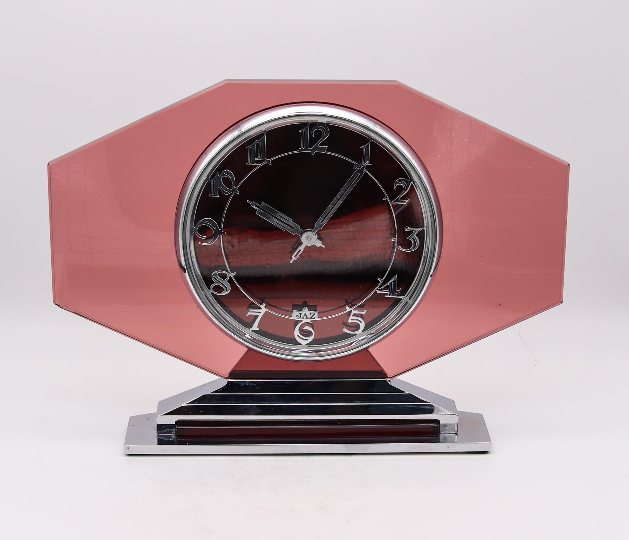 A desk clock designed by Jaz Paris.

A beautiful and very handsome desk clock, created in Paris France by the the clock company of Jaz during the art deco period, back in the early 1930. This very decorative piece is very hard to find has been