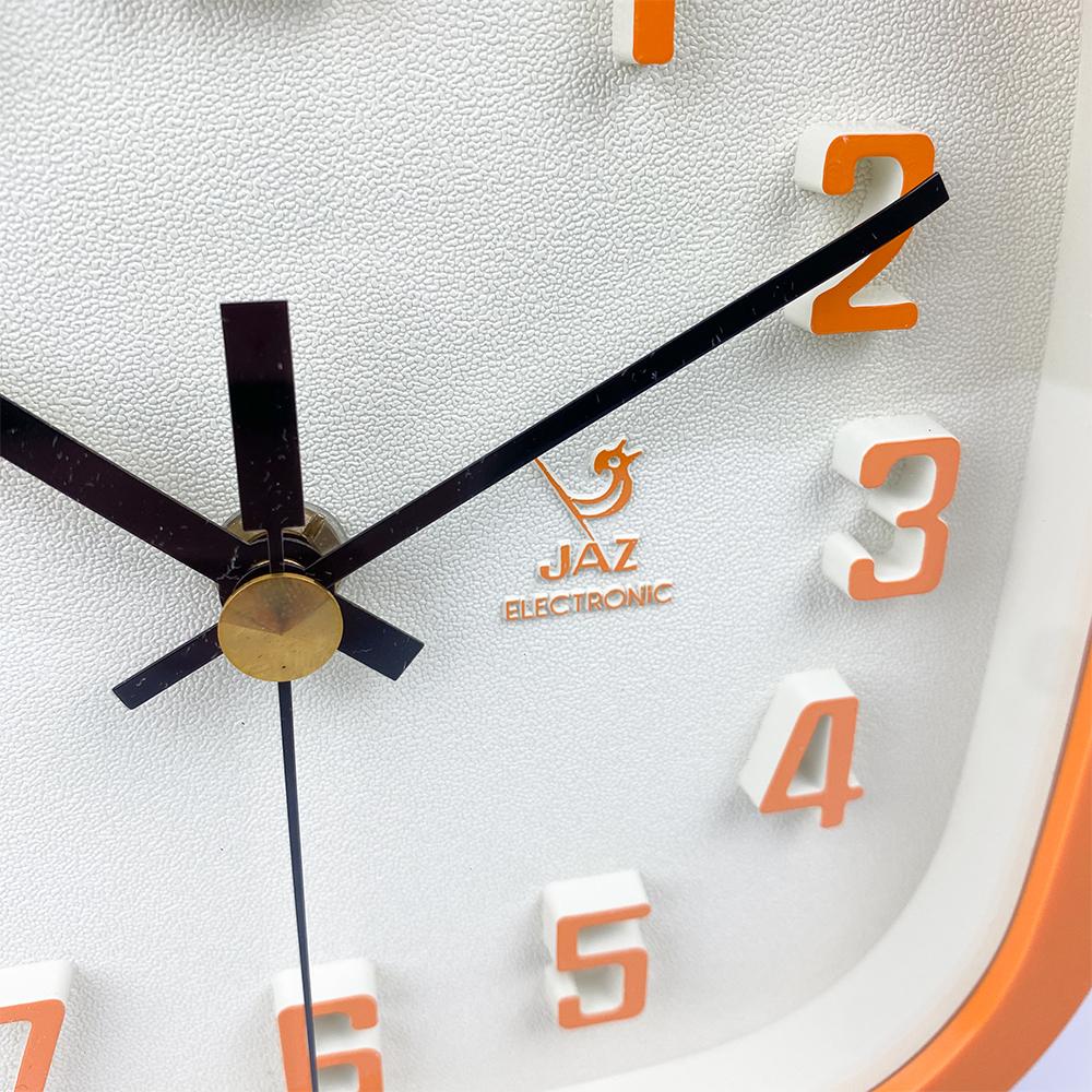 Jaz wall clock, 1970's.

Orange and white plastic. 

Working properly, Jaz mechanism.

Dimensions: 20x20x6 cm.

