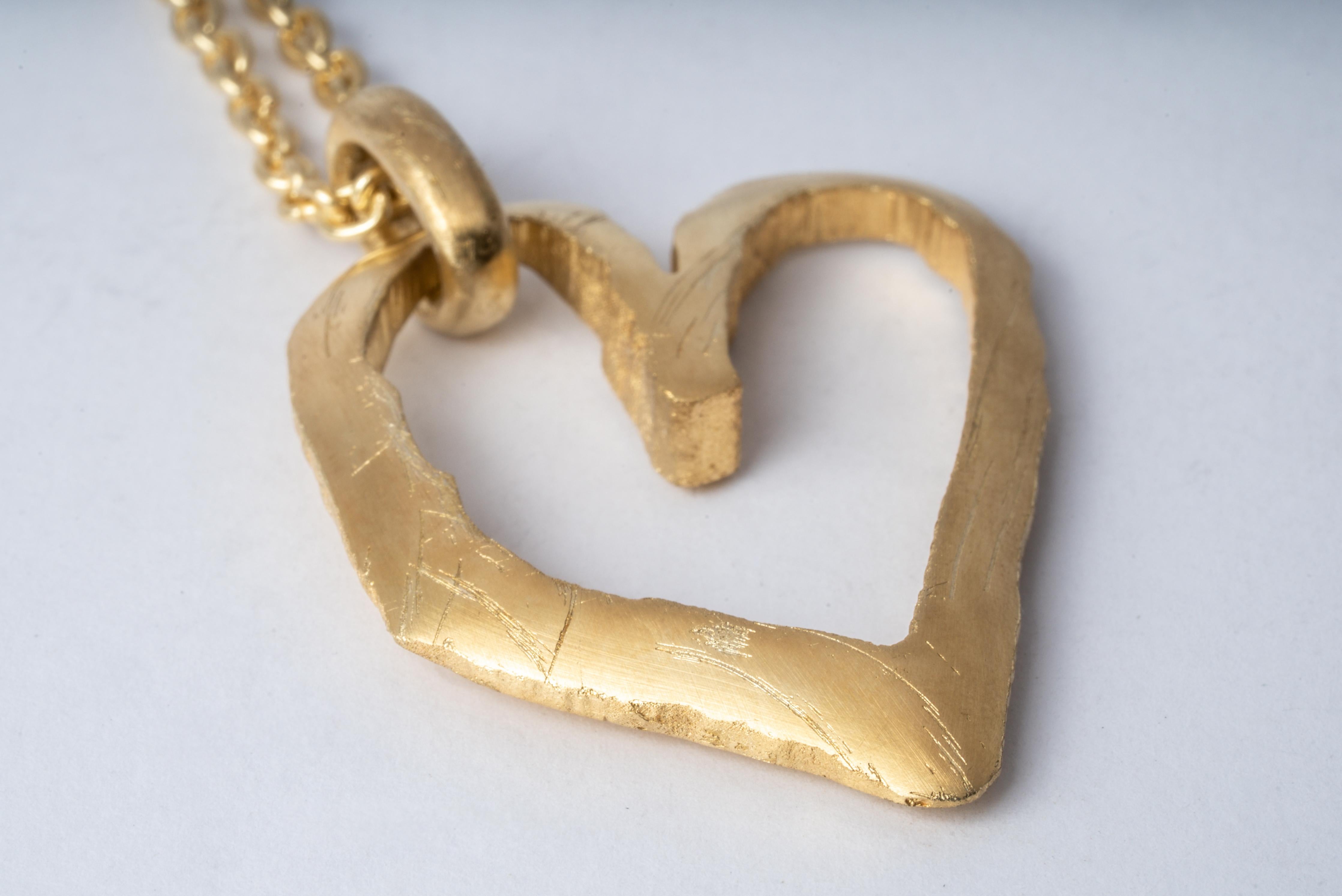 Jazz's Heart Necklace in brass and sterling silver with 18k rose gold then dipped into acid. This series is based on a heart that Jazz, Evan’s daughter, drew directly on his chest when she was five years old. That day they went and had it tattooed
