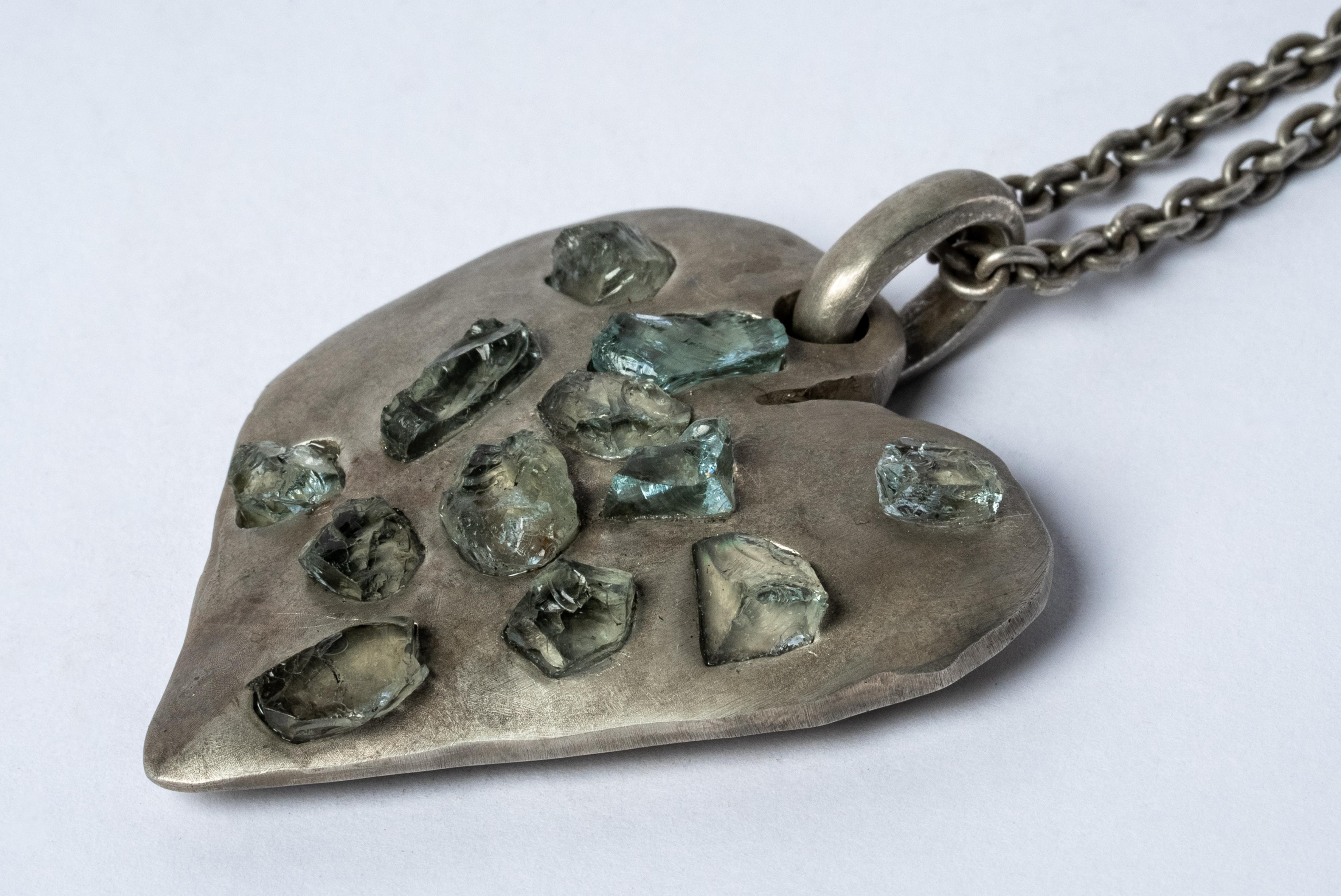 Jazz's Solid Heart Necklace in sterling silver and aquamarines. This series is based on a heart that Jazz, Evan’s daughter, drew directly on his chest when she was five years old.
This item is made with a naturally occurring element and will vary