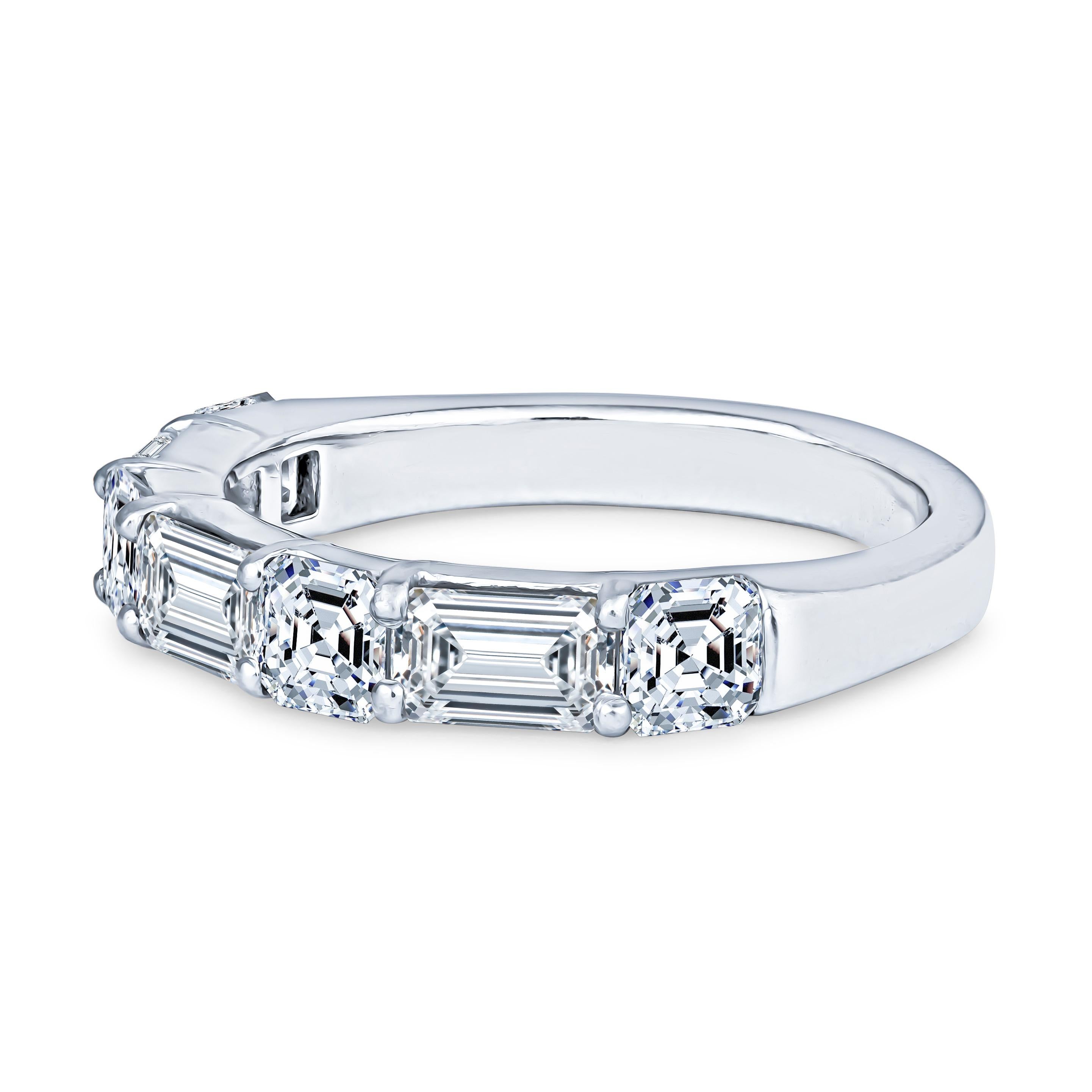 This exquisite JB Star ring has a 2.47ct total diamond weight, set in a platinum wedding band. Three of those diamonds are emerald cut, with a total weight of 1.25ct and the other four diamonds are asscher cut, at 1.22ct total weight. The ring
