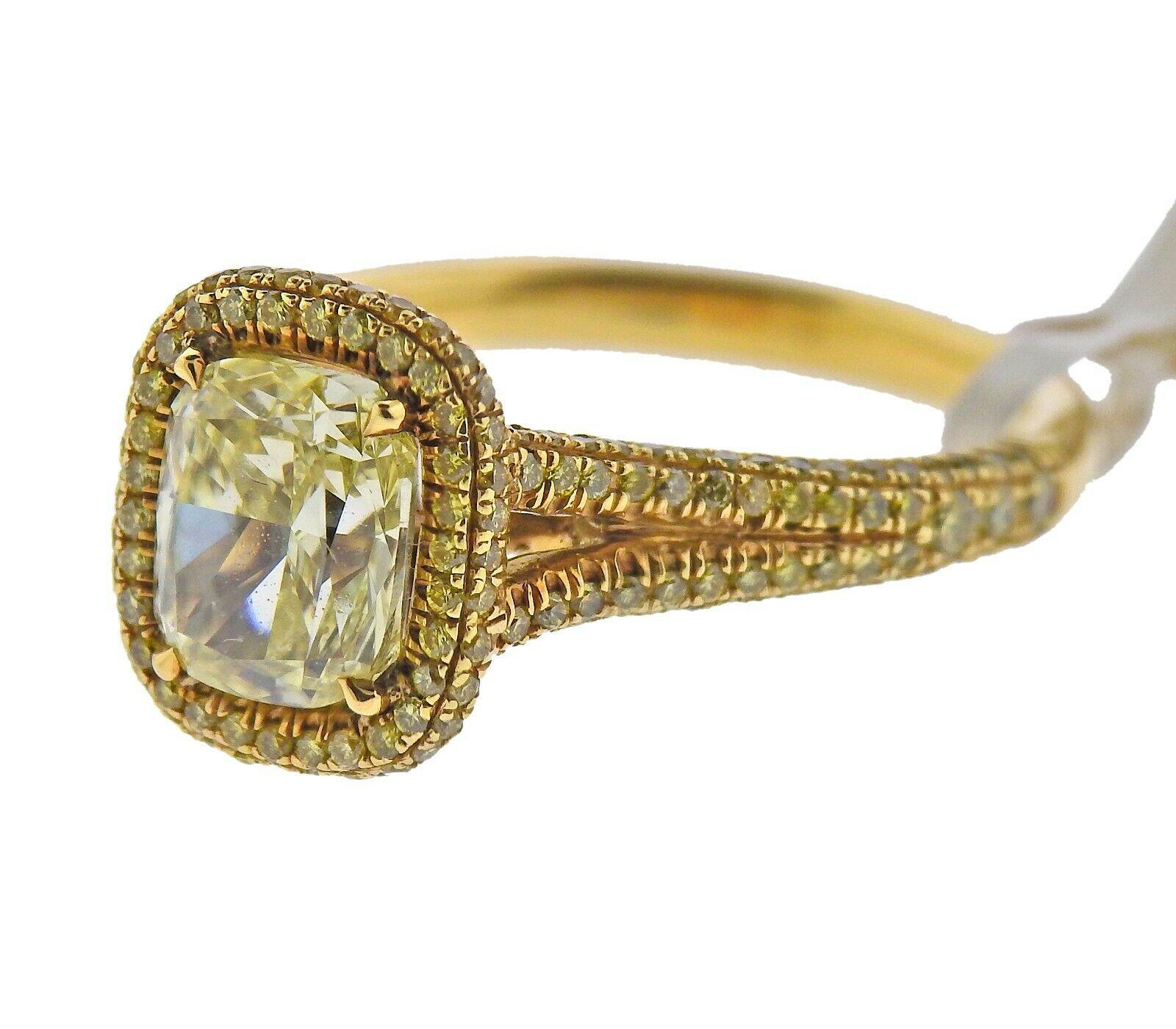 18k yellow gold ring by JB star. Set with a natural VS/ Fancy Yellow 1.72ct center diamond, adorned with 226 round VS/ fancy yellow diamonds totaling 0.74ctw. Ring size - 5.5, ring top - 11mm x 9.5mm. Marked - 18kp. Weight - 5.4 grams. Retail