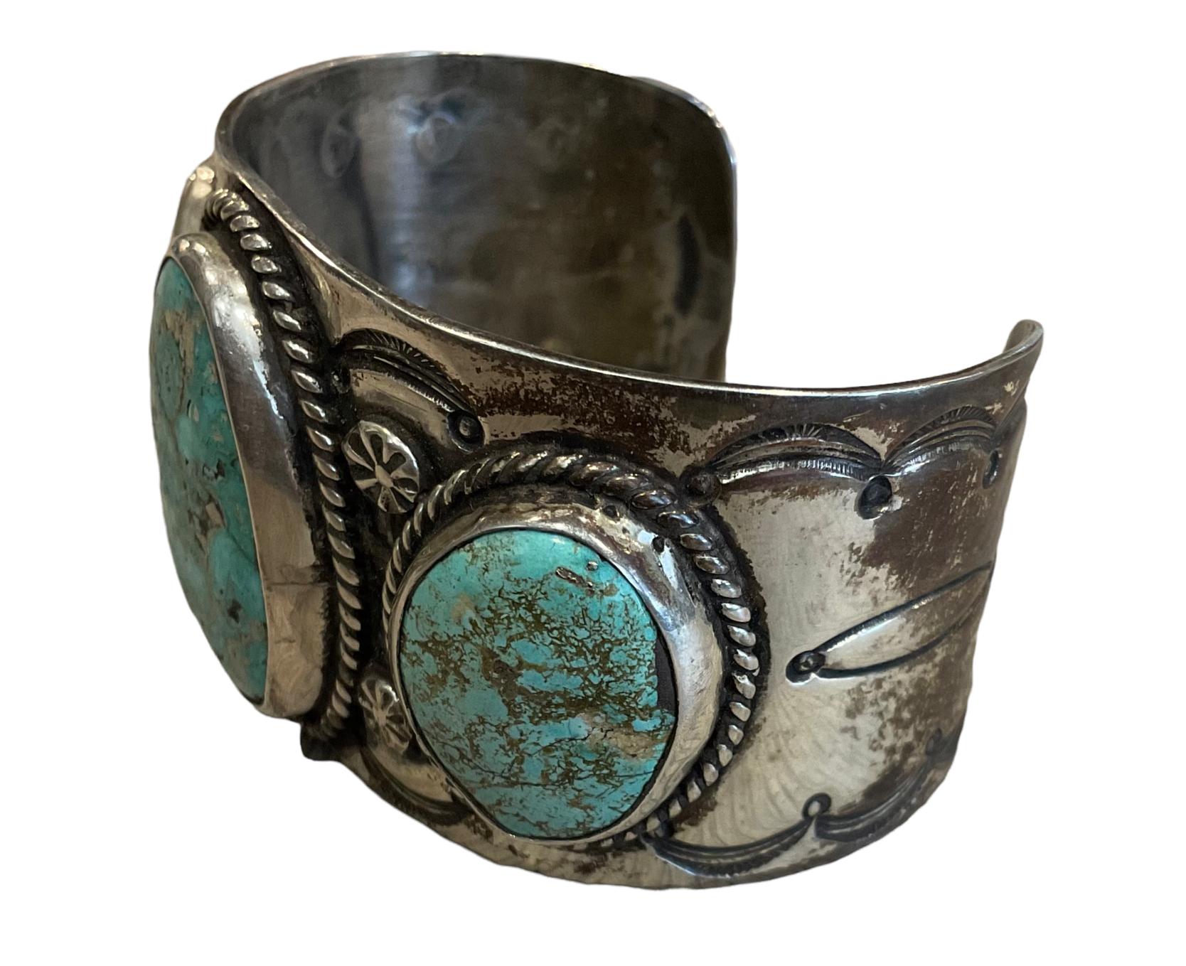 This Native American sterling silver cuff with sunbursts is clearly stamped JC with a sunburst hallmark and contains ultra-rare Morenci Turquoise, revealing a stunning Pyrite matrix. This piece is substantial and is a favorite of mine to offer. I