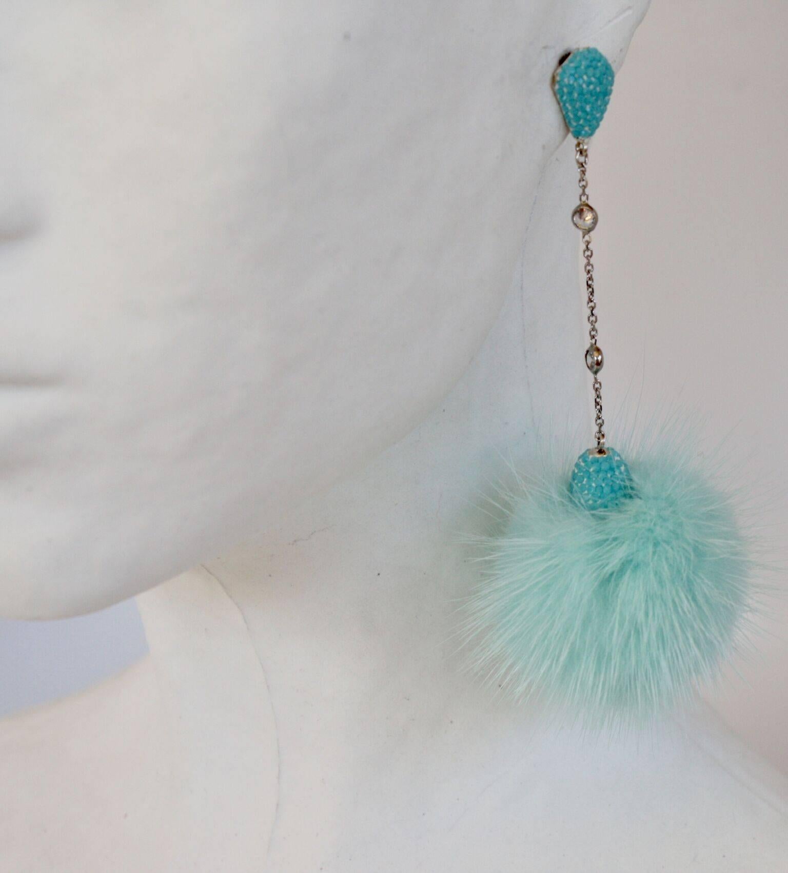 Dyed mink and Swarovski crystal pierced earrings from JCM London. 