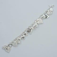JCM Polished and Textured Sterling Silver Heart Charm Bracelet