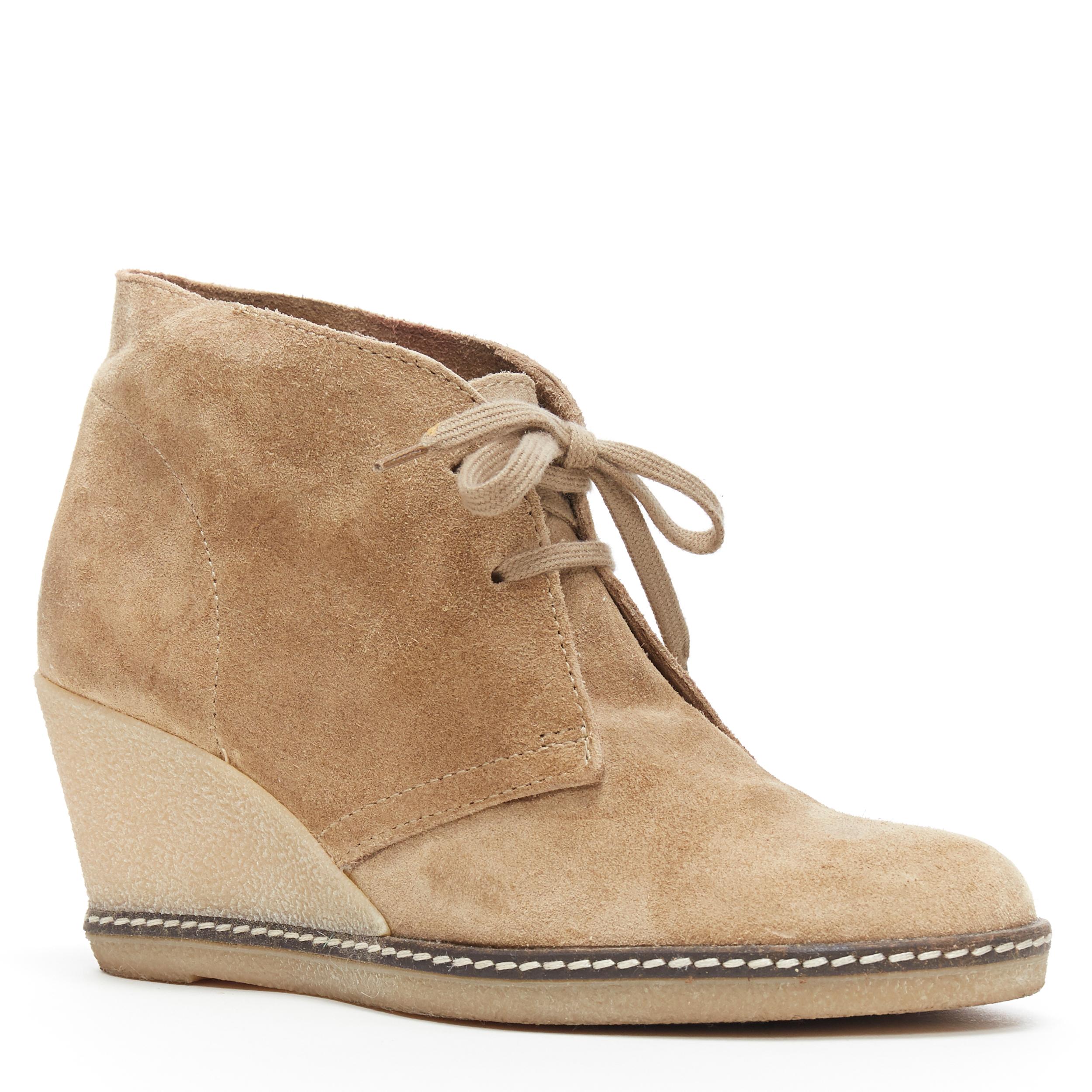 J.CREW tan suede rubber wedge lace front desert bootie EU37.5 
Reference: LNKO/A01379 
Brand: J.CREW 
Material: Suede 
Color: Brown 
Pattern: Solid 
Closure: Lace Up 
Made in: Italy 


CONDITION: 
Condition: Fair, this item was pre-owned and is in